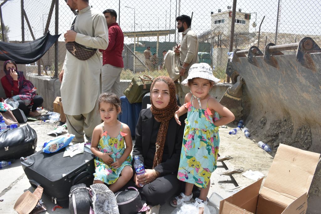 Afghans continue to wait at airport in Kabul