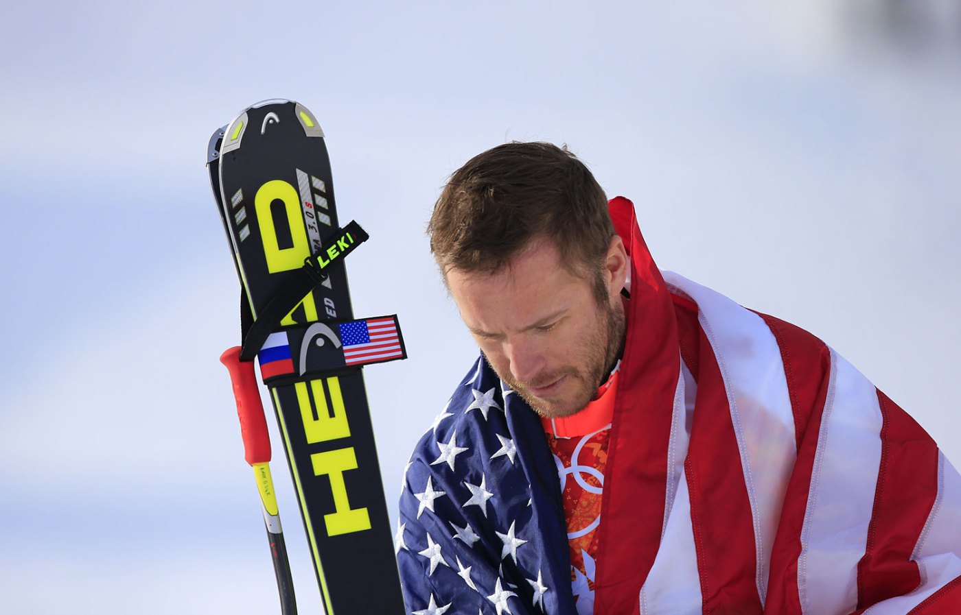 Bode Miller arrives on the podium during the Men's Alpine Skiing Super-G Flower Ceremony.