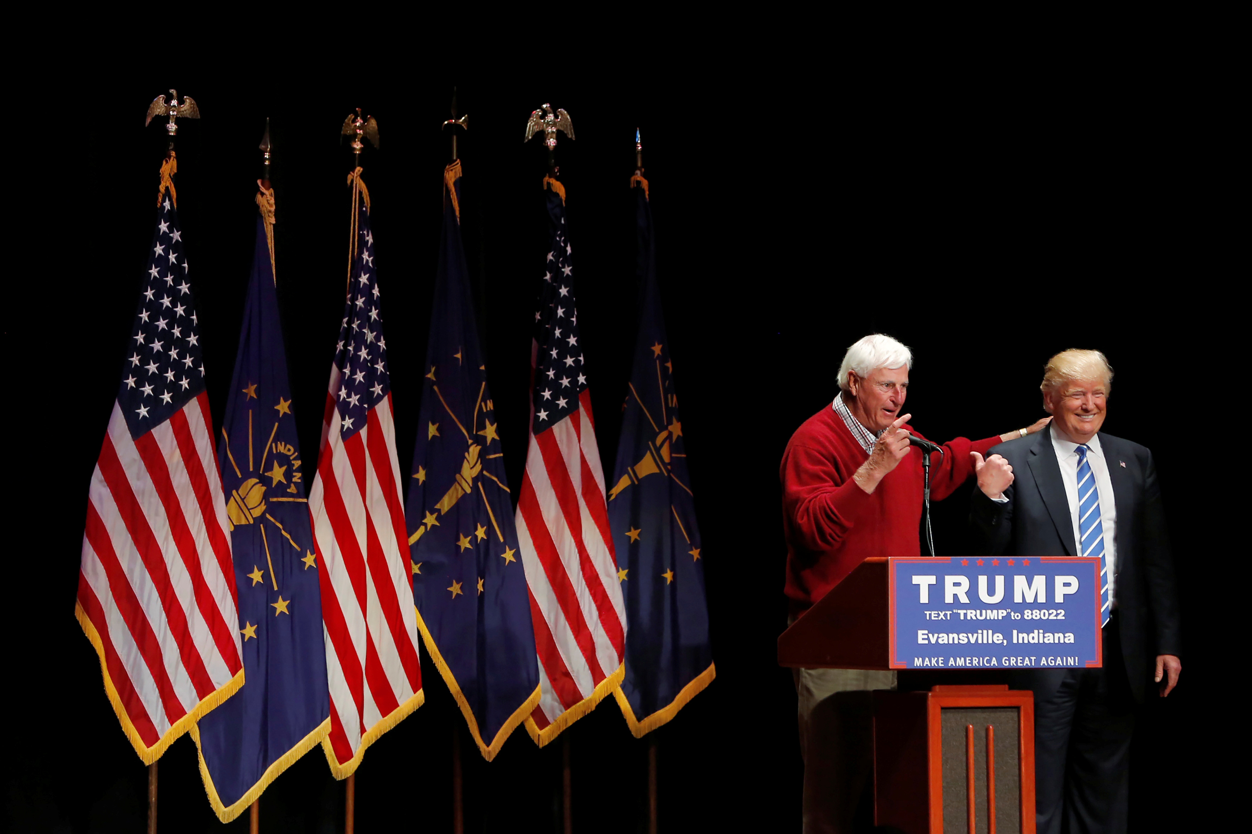 U.S. Republican presidential candidate Donald Trump is joined on stage by former Indiana University basketball coach Bob Knight at a campaign event at the Old National Events Plaza in Evansville, Indiana, U.S., April 28, 2016. REUTERS/Aaron P. Bernstein 
