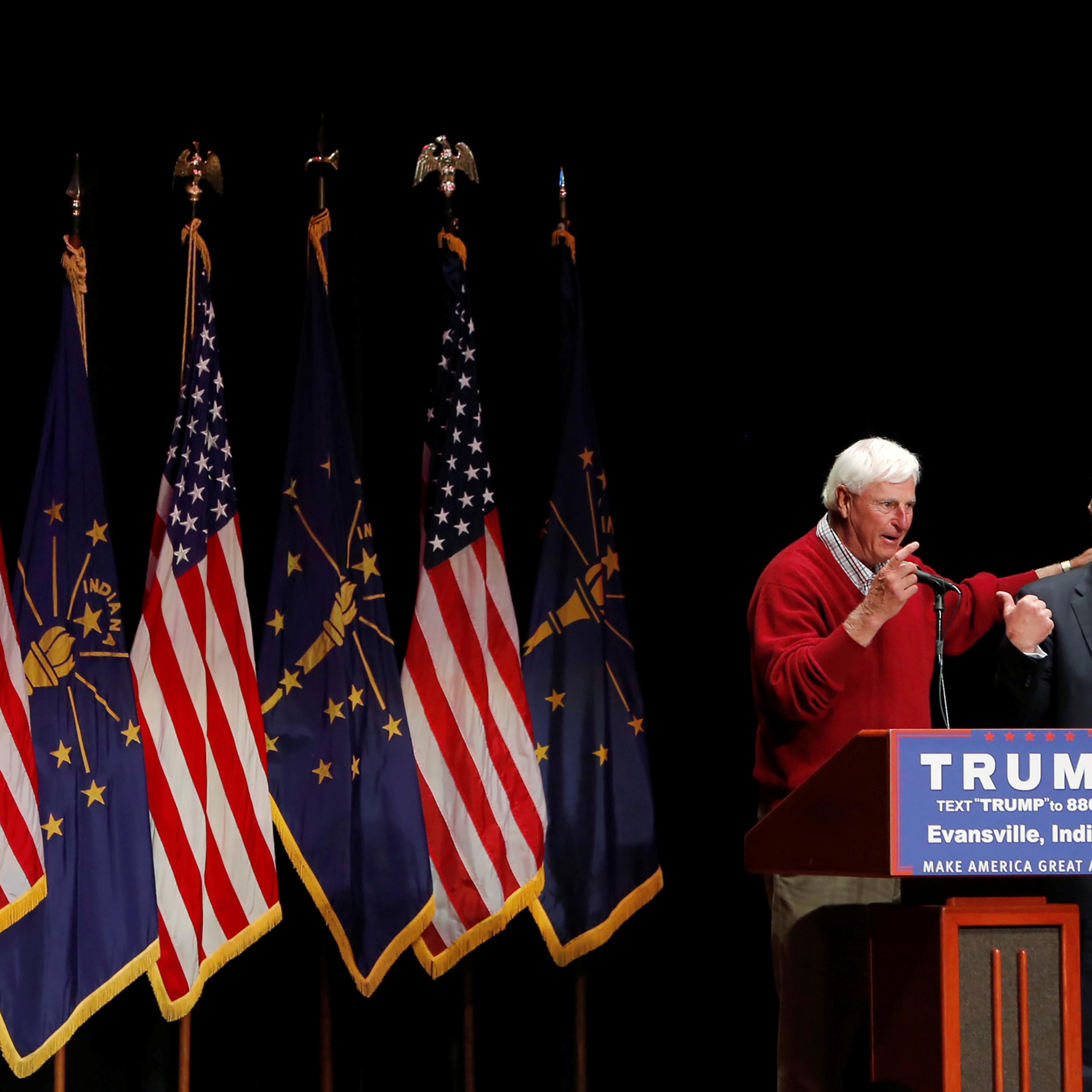 U.S. Republican presidential candidate Donald Trump is joined on stage by former Indiana University basketball coach Bob Knight at a campaign event at the Old National Events Plaza in Evansville, Indiana, U.S., April 28, 2016. REUTERS/Aaron P. Bernstein