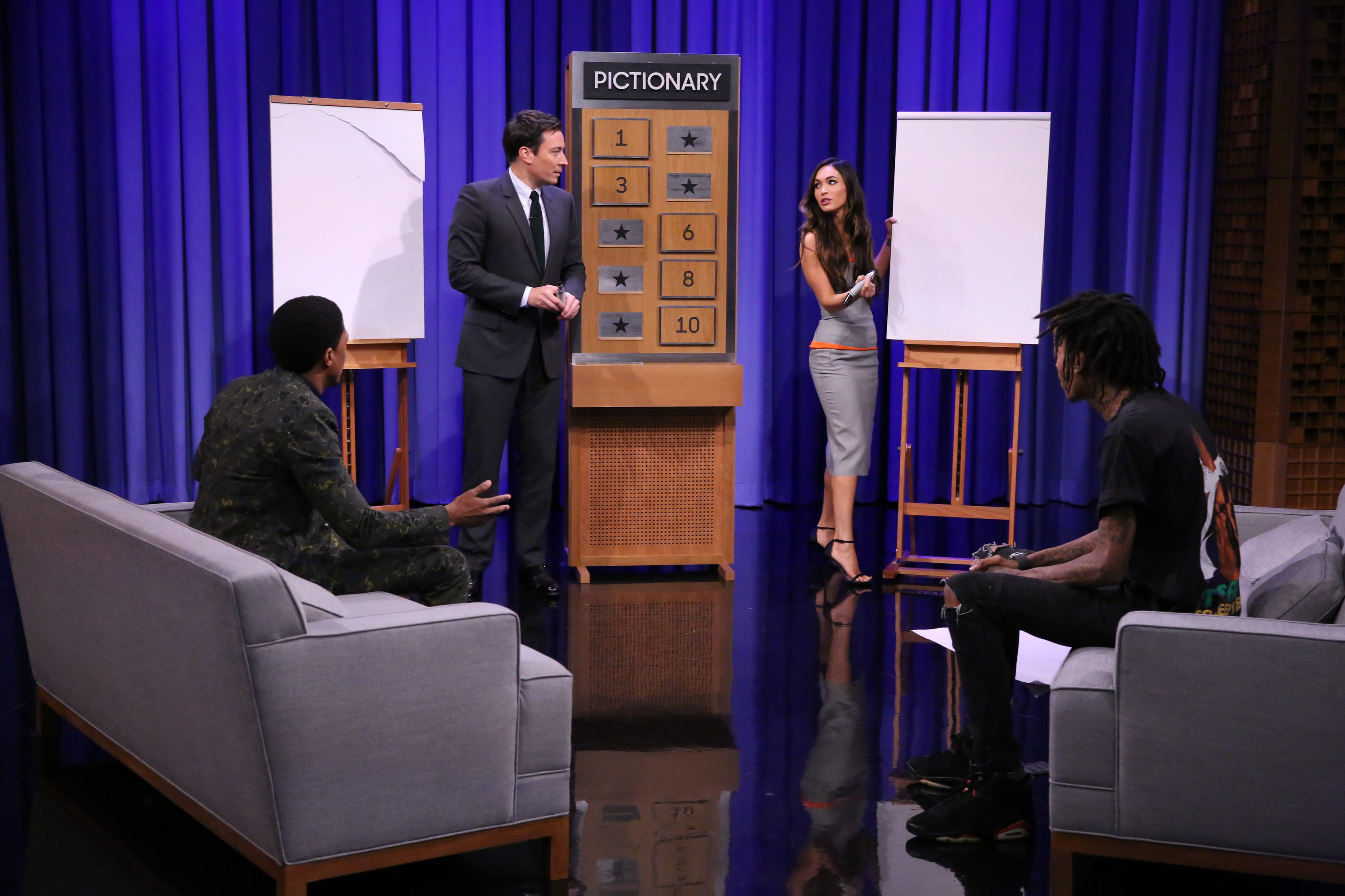 Actor Nick Cannon, host Jimmy Fallon, actress Megan Fox and rapper Wiz Khalifa play pictionary on August 6, 2014