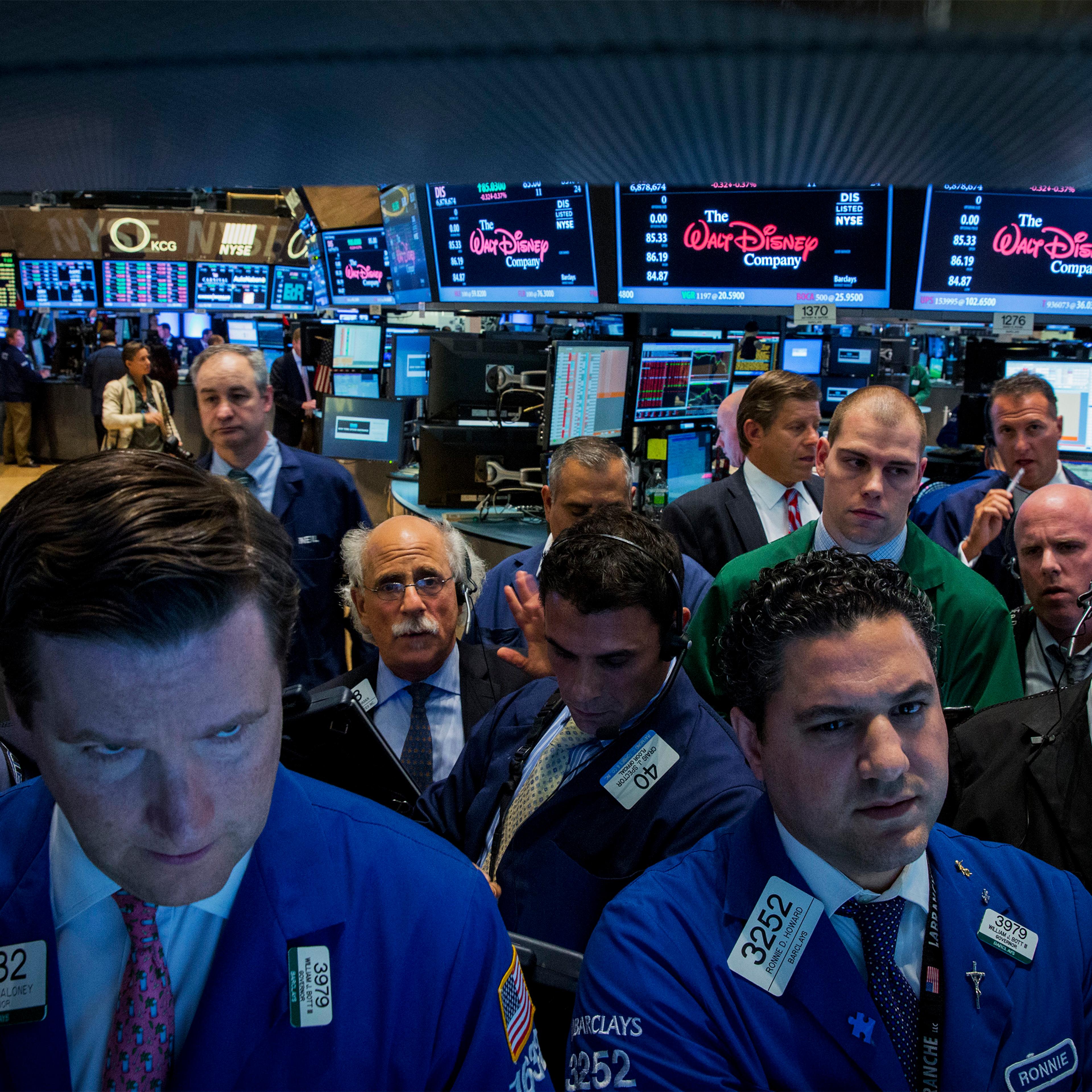 Traders work on the floor of the New York Stock Exchange