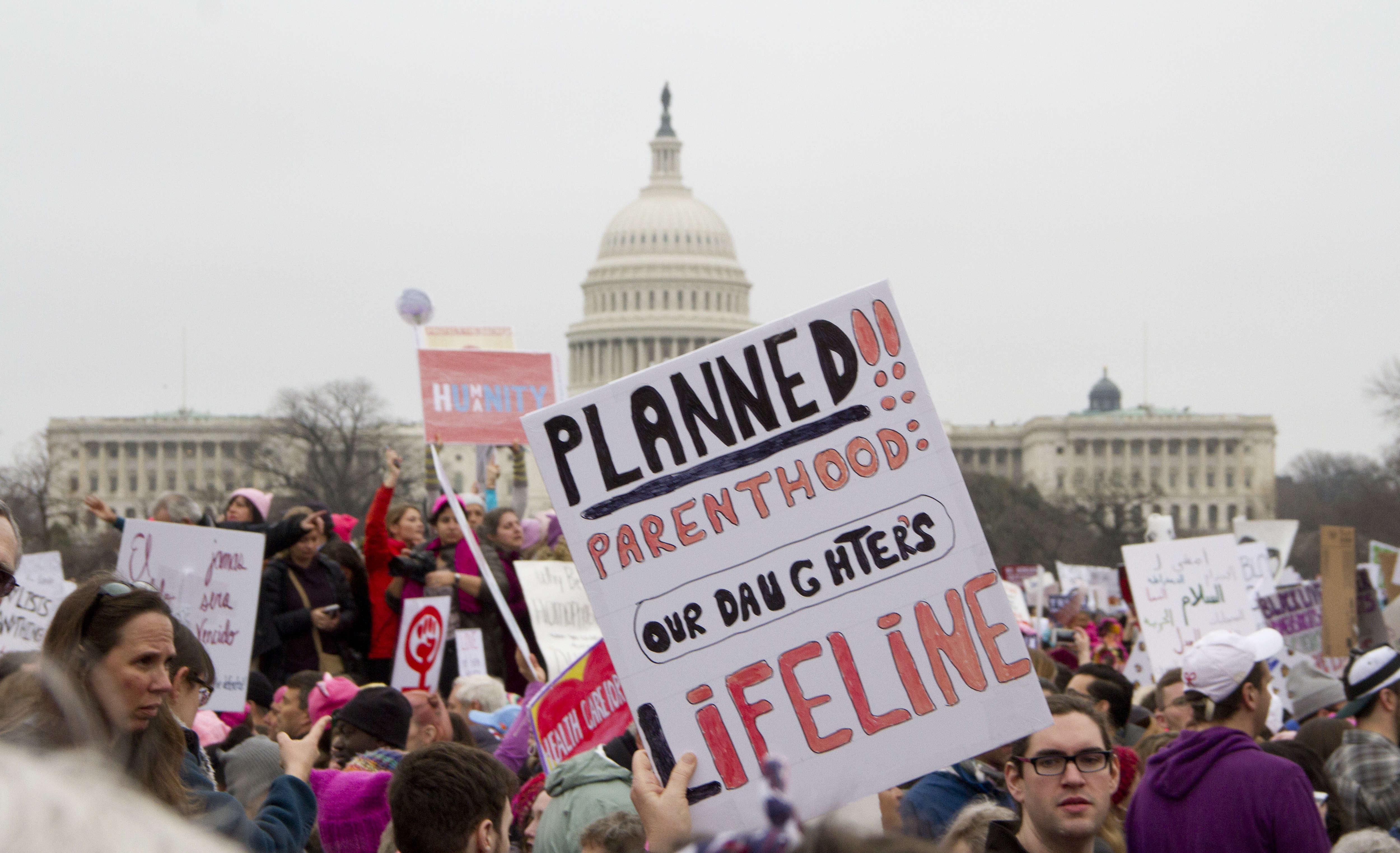 People take part in the Million Woman March one day after