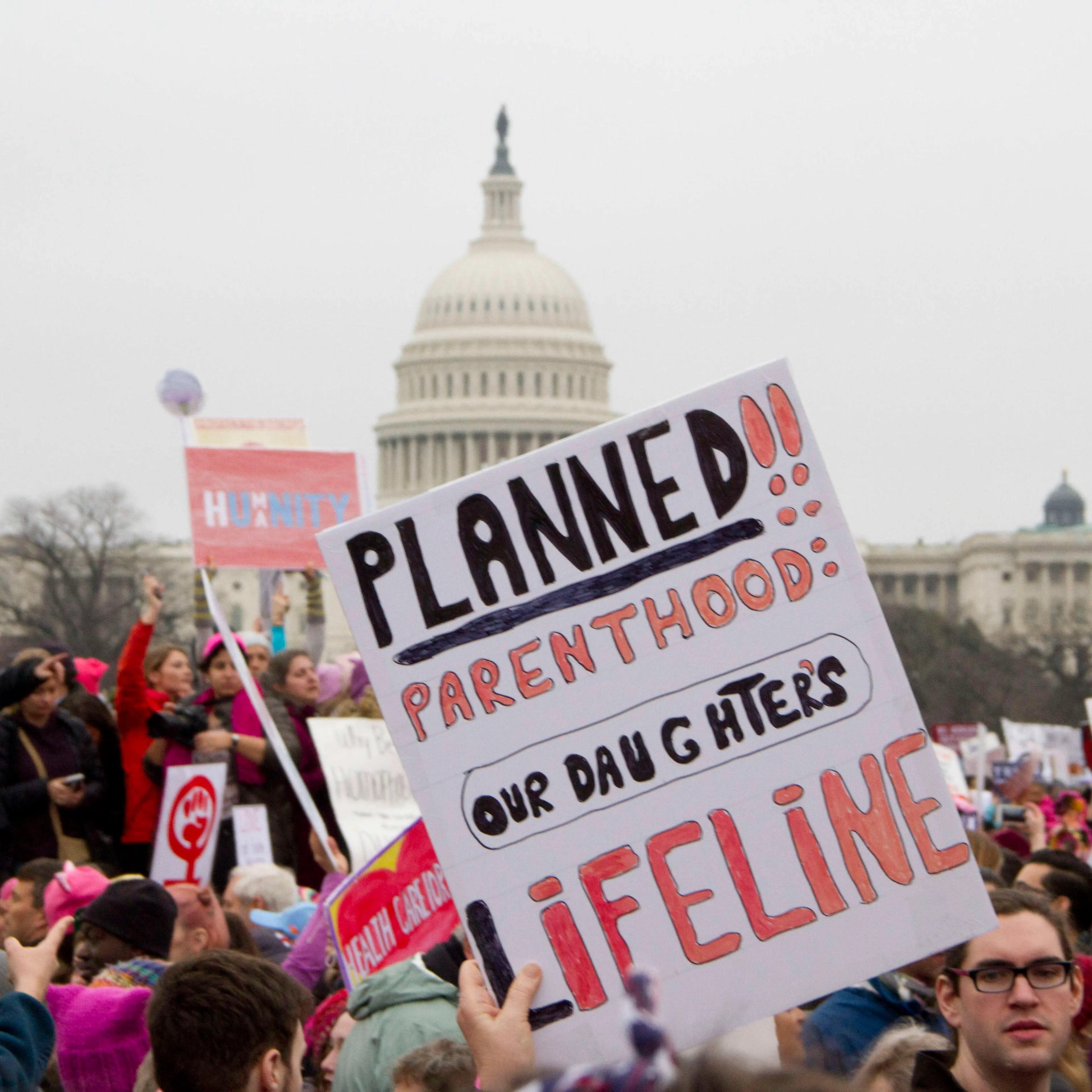 People take part in the Million Woman March one day after