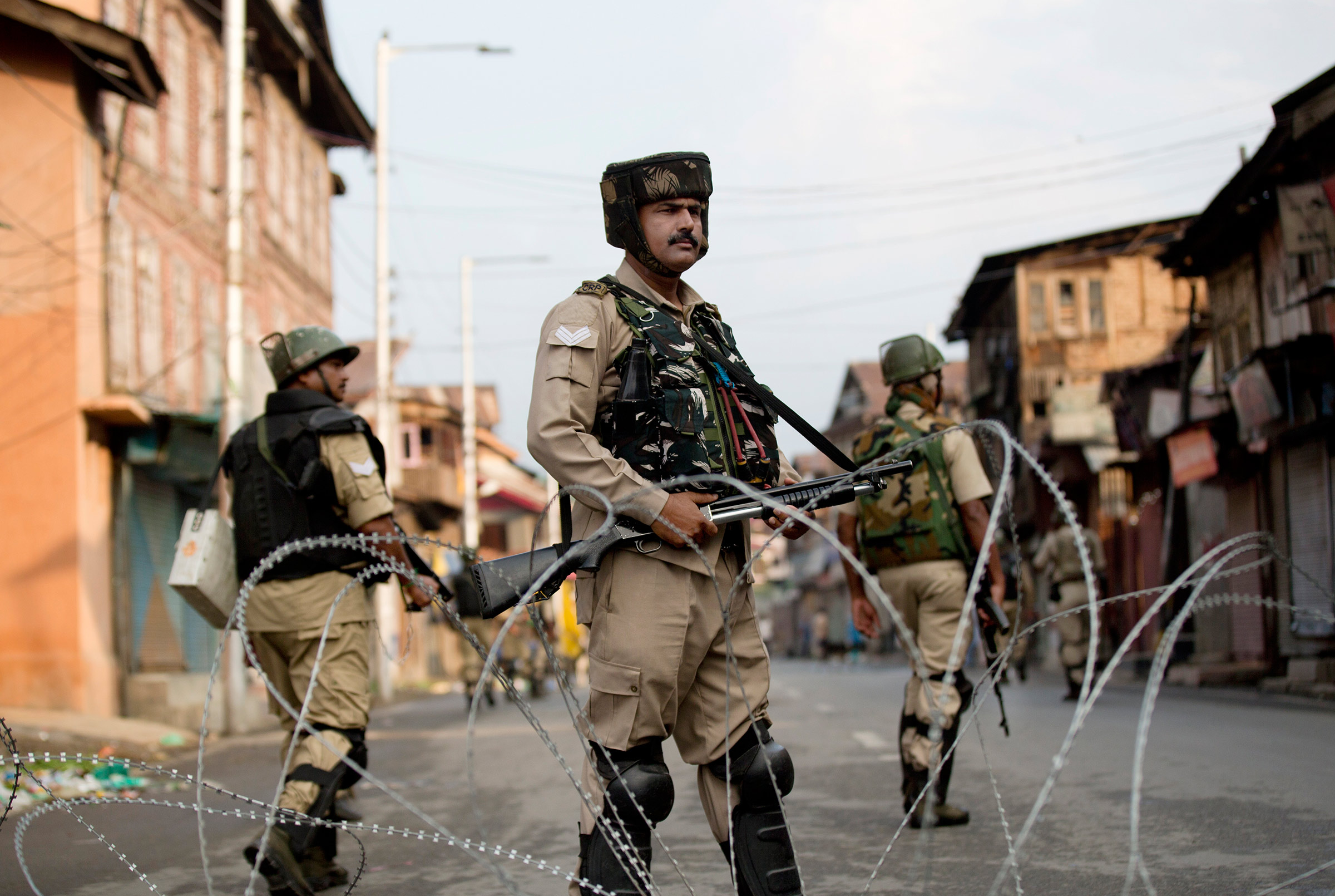 Indian Paramilitary soldiers stand guard during curfew in Srinagar, Indian controlled Kashmir, Wednesday, Aug. 7, 2019. Authorities in Hindu-majority India clamped a complete shutdown on Kashmir as they scrapped the Muslim-majority state's special status