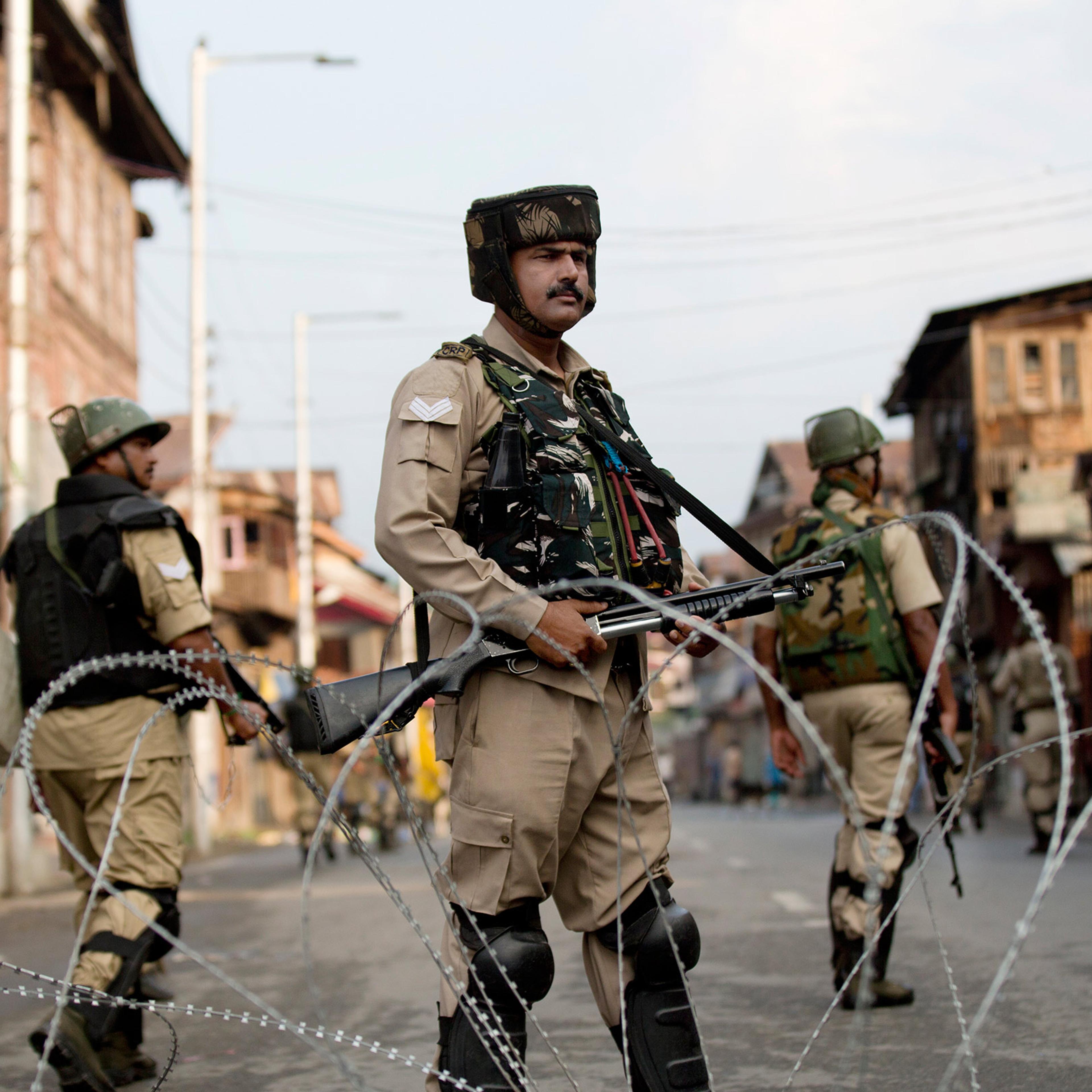 Indian Paramilitary soldiers stand guard during curfew in Srinagar, Indian controlled Kashmir, Wednesday, Aug. 7, 2019. Authorities in Hindu-majority India clamped a complete shutdown on Kashmir as they scrapped the Muslim-majority state's special status