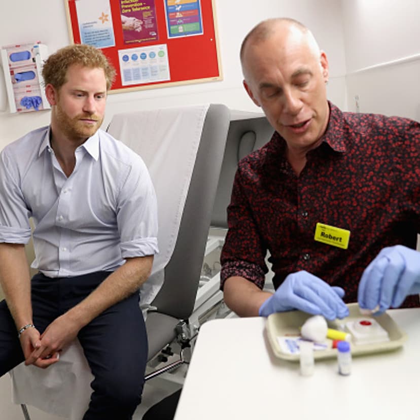 Prince Harry waits for the results of an HIV test taken by Specialist Psychotherapist Robert Palmer as visits Burrell Street Sexual Health Clinic on July 14, 2016 in London, England.