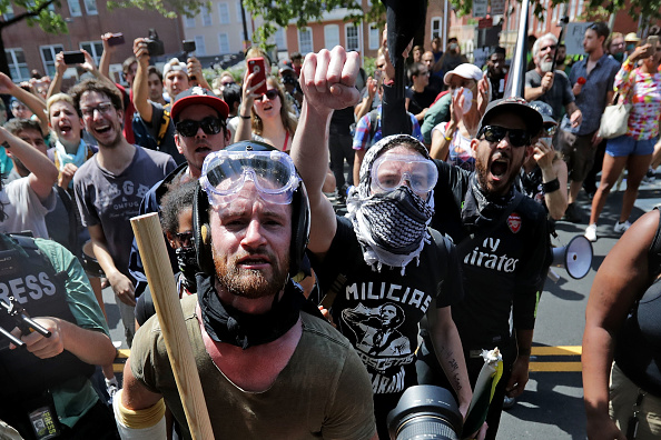Anti-fascist counter-protesters wait outside Emancipation Park to hurl insluts as white nationalists, neo-Nazis and members of the "alt-right" are forced out after the "Unite the Right" rally was declared an unlawful gathering August 12, 2017 in Charlott