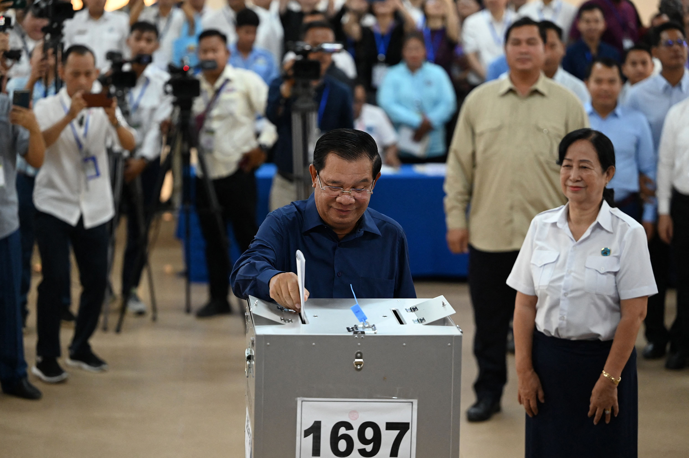 Cambodia's Prime Minister Hun Sen casts his vote at a polling station in Kandal province on July 23 during the general elections. 
