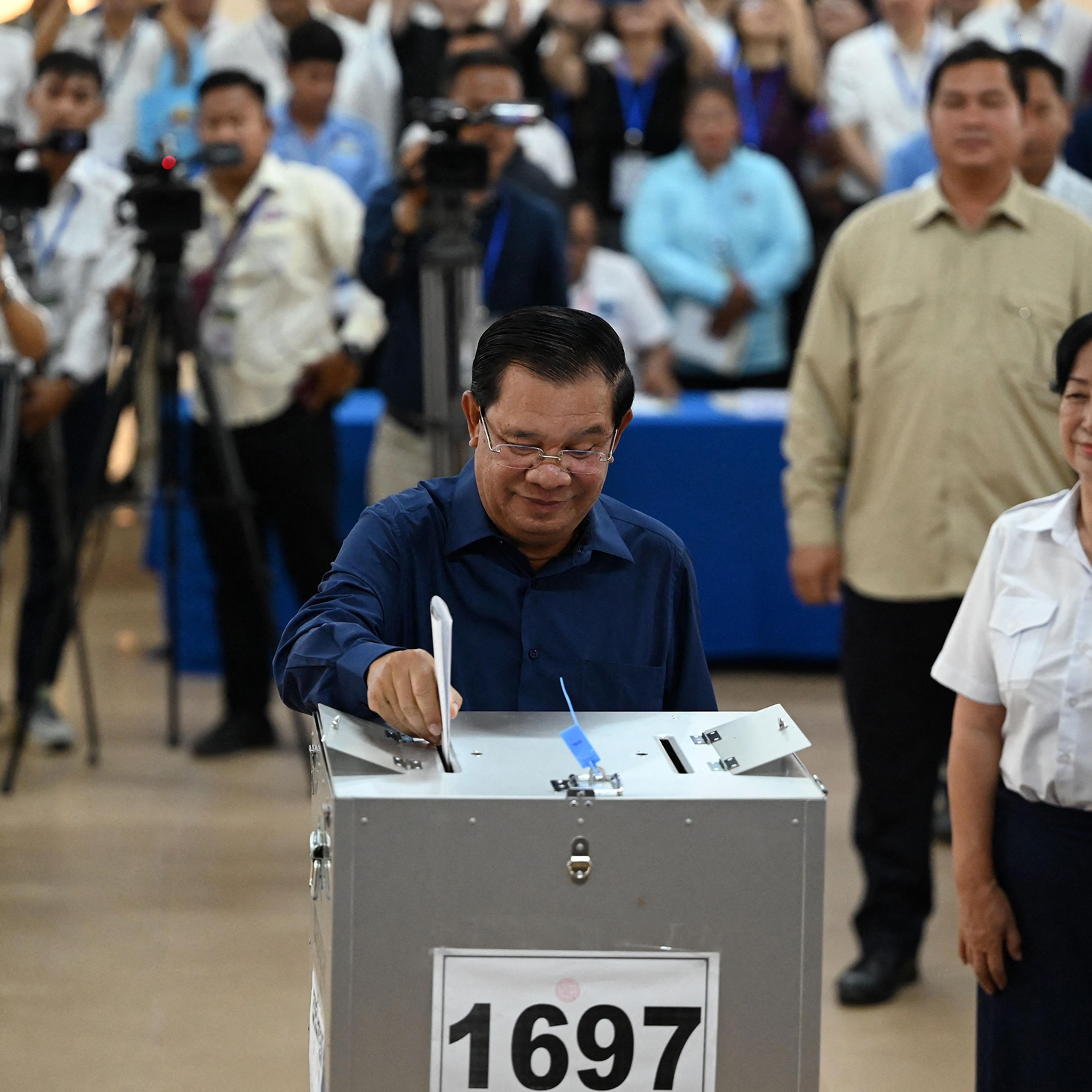 Cambodia's Prime Minister Hun Sen casts his vote at a polling station in Kandal province on July 23 during the general elections.
