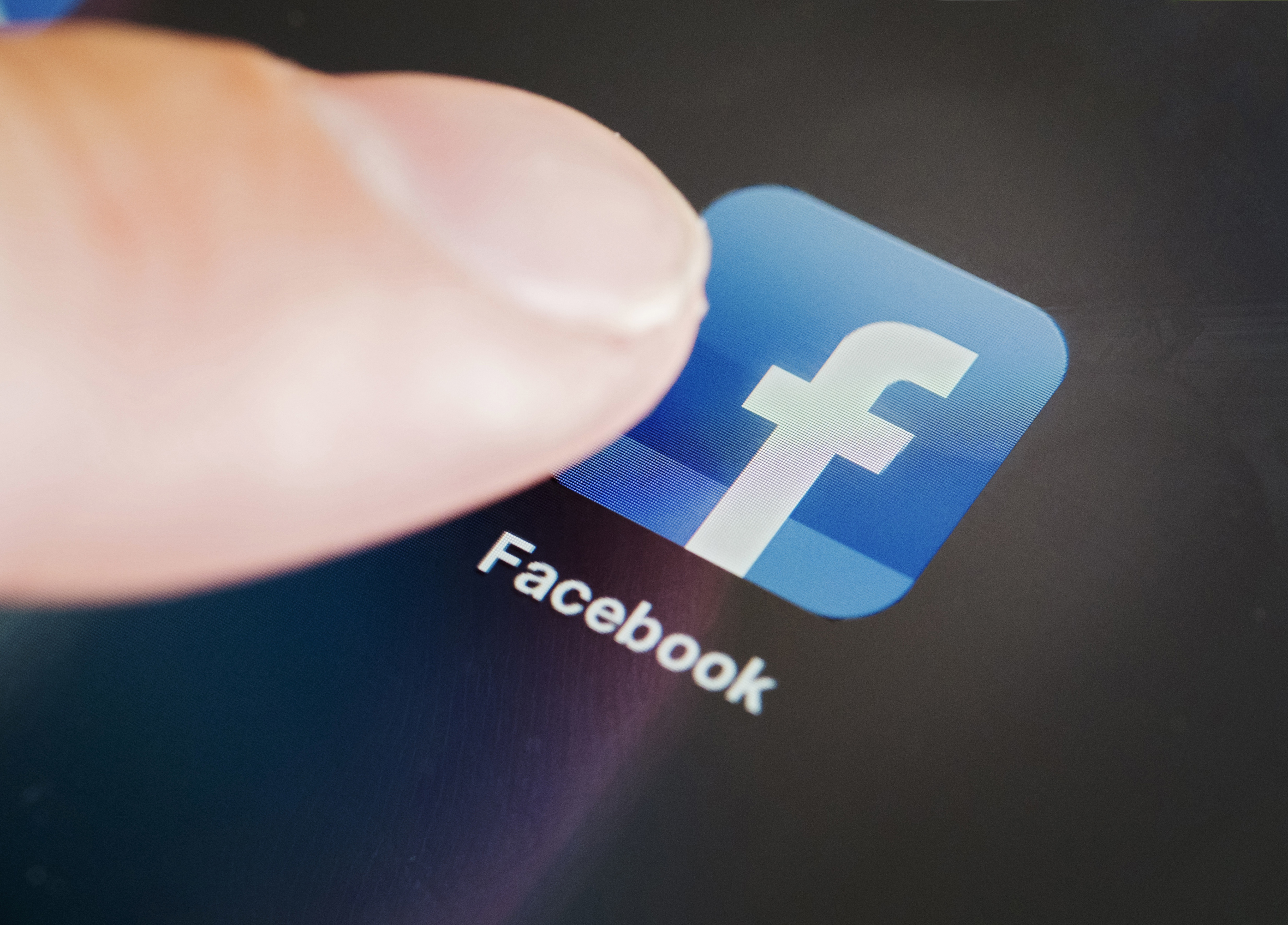 Detail of Facebook social media app icon on iPad tablet computer screen