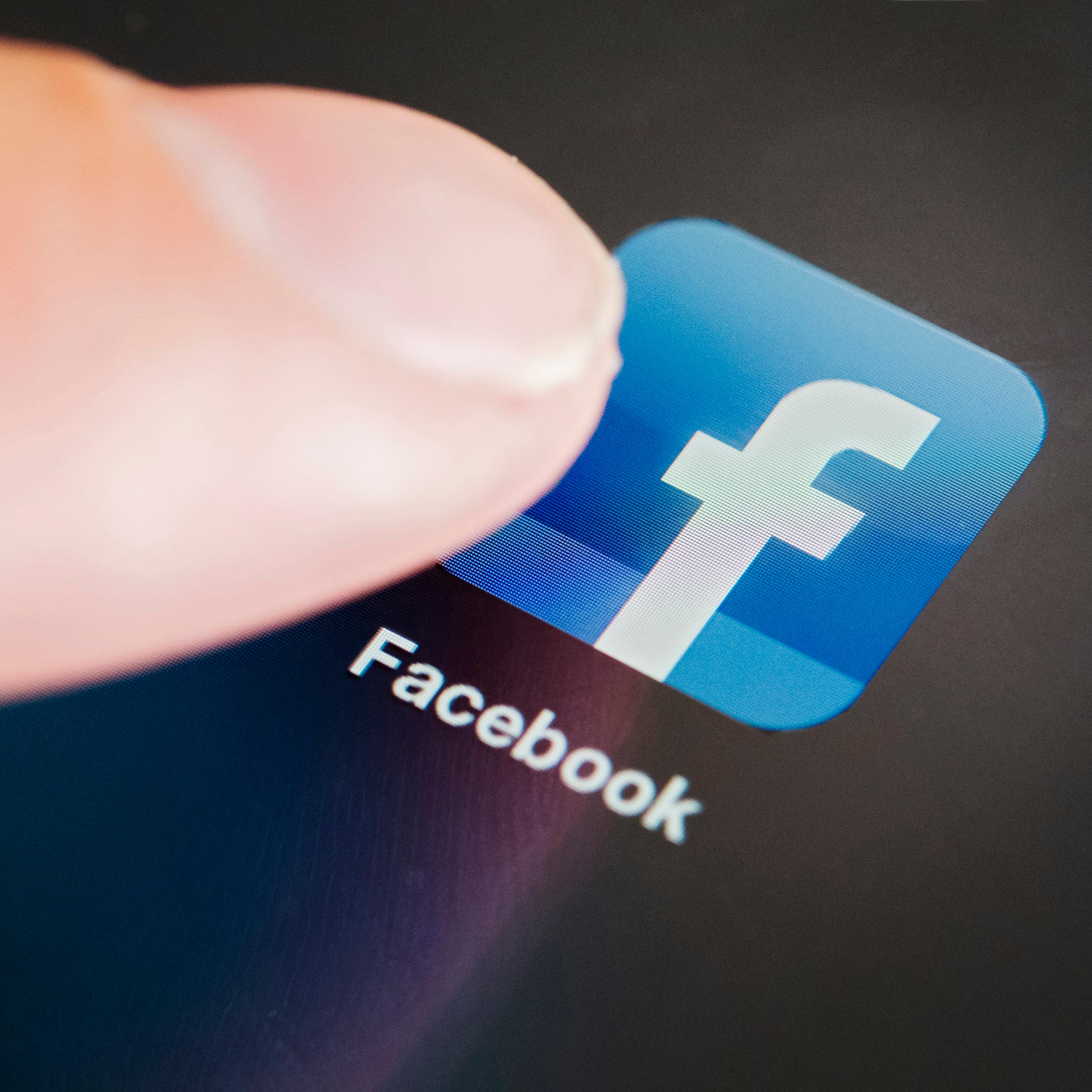 Detail of Facebook social media app icon on iPad tablet computer screen