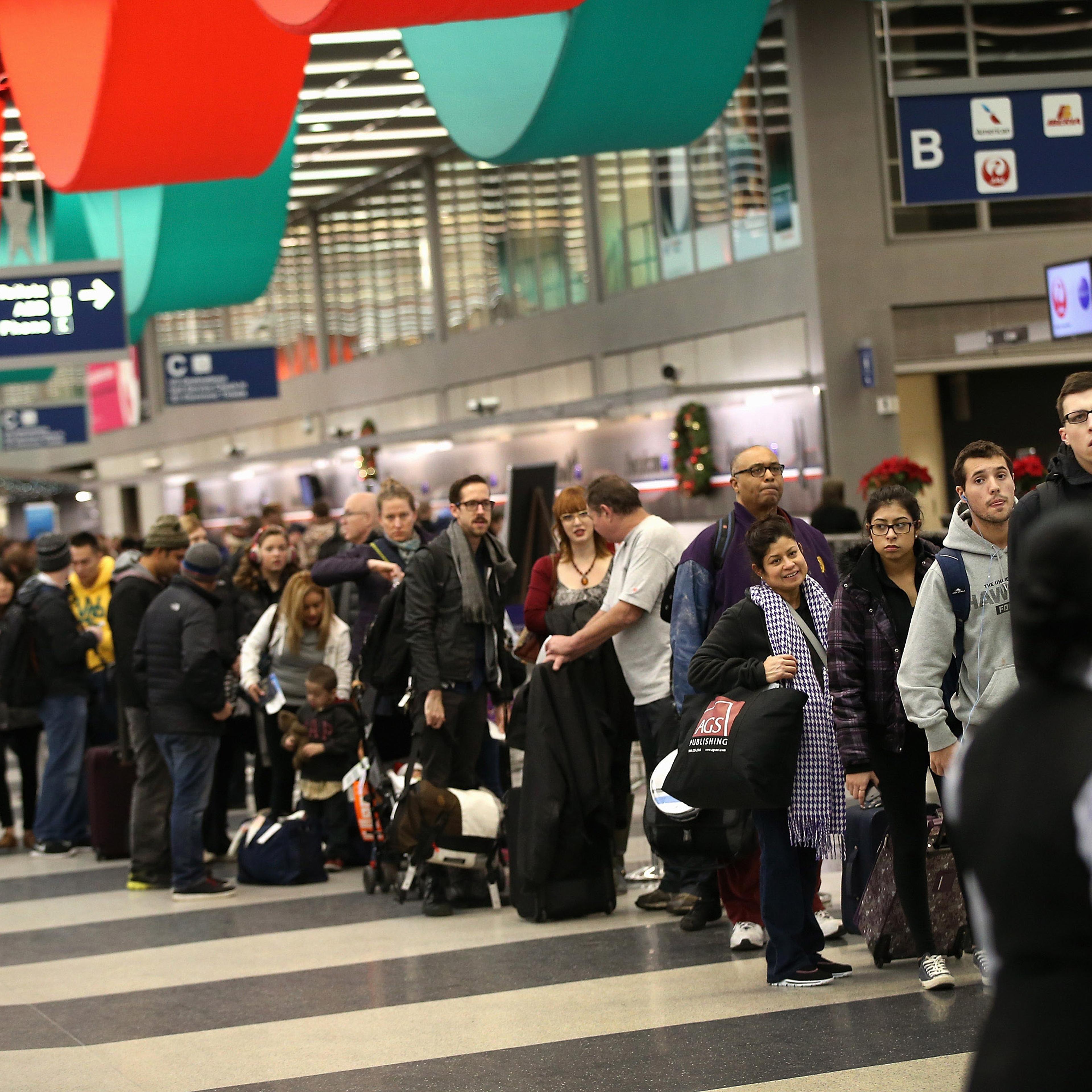 Holiday Travelers Crowd Airports Ahead Of The Holidays