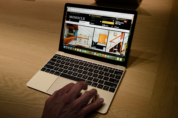 An attendee demonstrates the Apple Inc. Macbook during the Apple Inc. Spring Forward event in San Francisco on March 9, 2015.