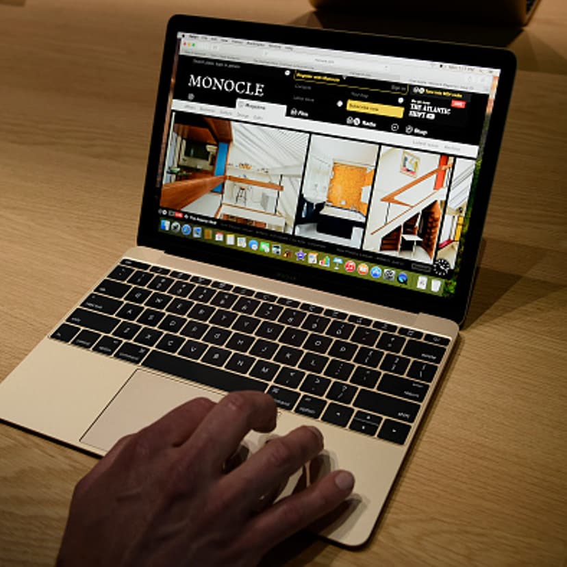 An attendee demonstrates the Apple Inc. Macbook during the Apple Inc. Spring Forward event in San Francisco on March 9, 2015.