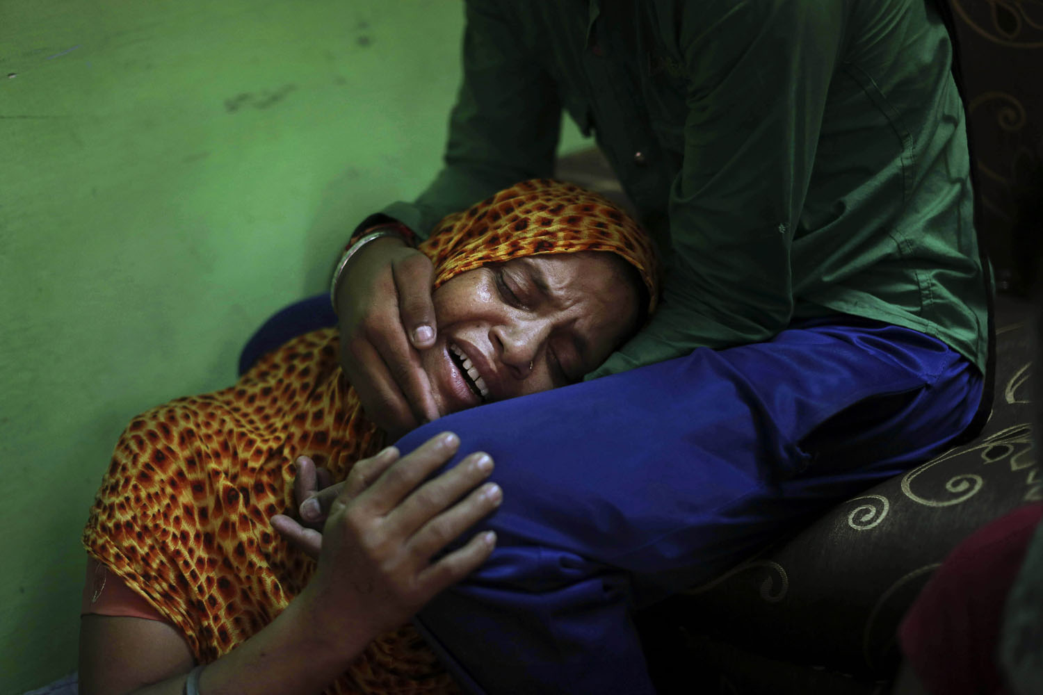 August 7, 2012. Lokinder Kaur, whose husband Ranjeet Singh was killed in the shooting attack at a Sikh temple in Wisconsin, mourns at the family home in New Delhi, India.
