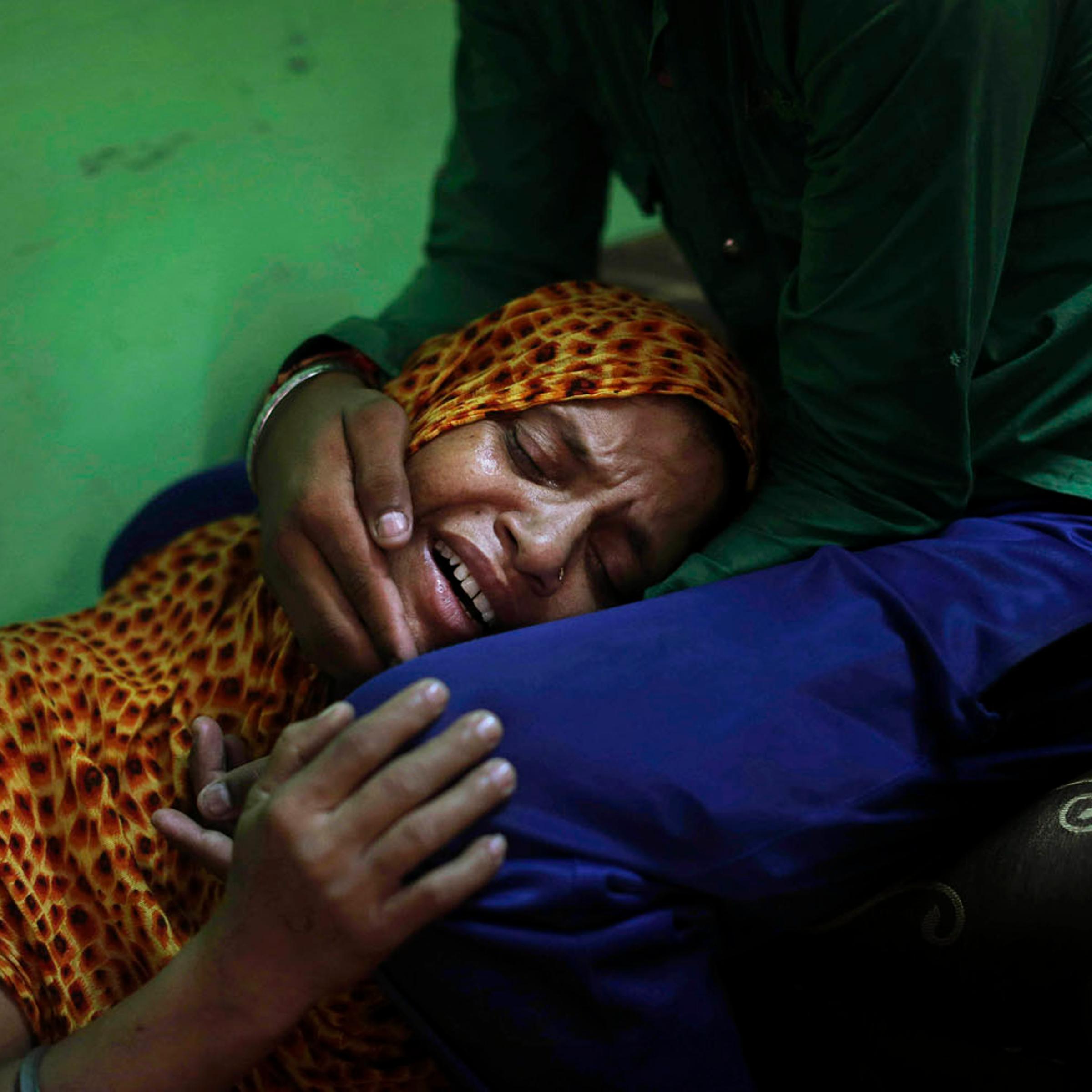 August 7, 2012. Lokinder Kaur, whose husband Ranjeet Singh was killed in the shooting attack at a Sikh temple in Wisconsin, mourns at the family home in New Delhi, India.