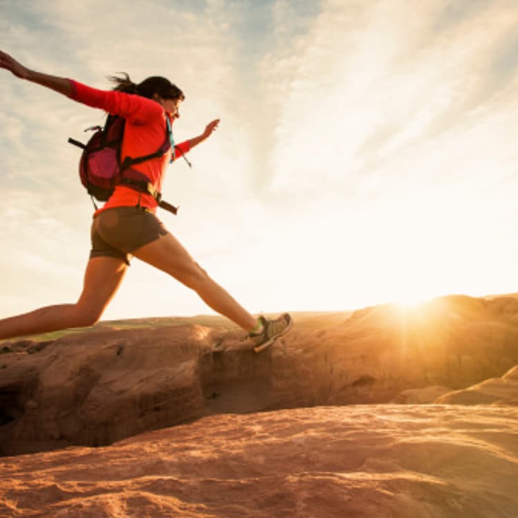 female-hiker-jumping
