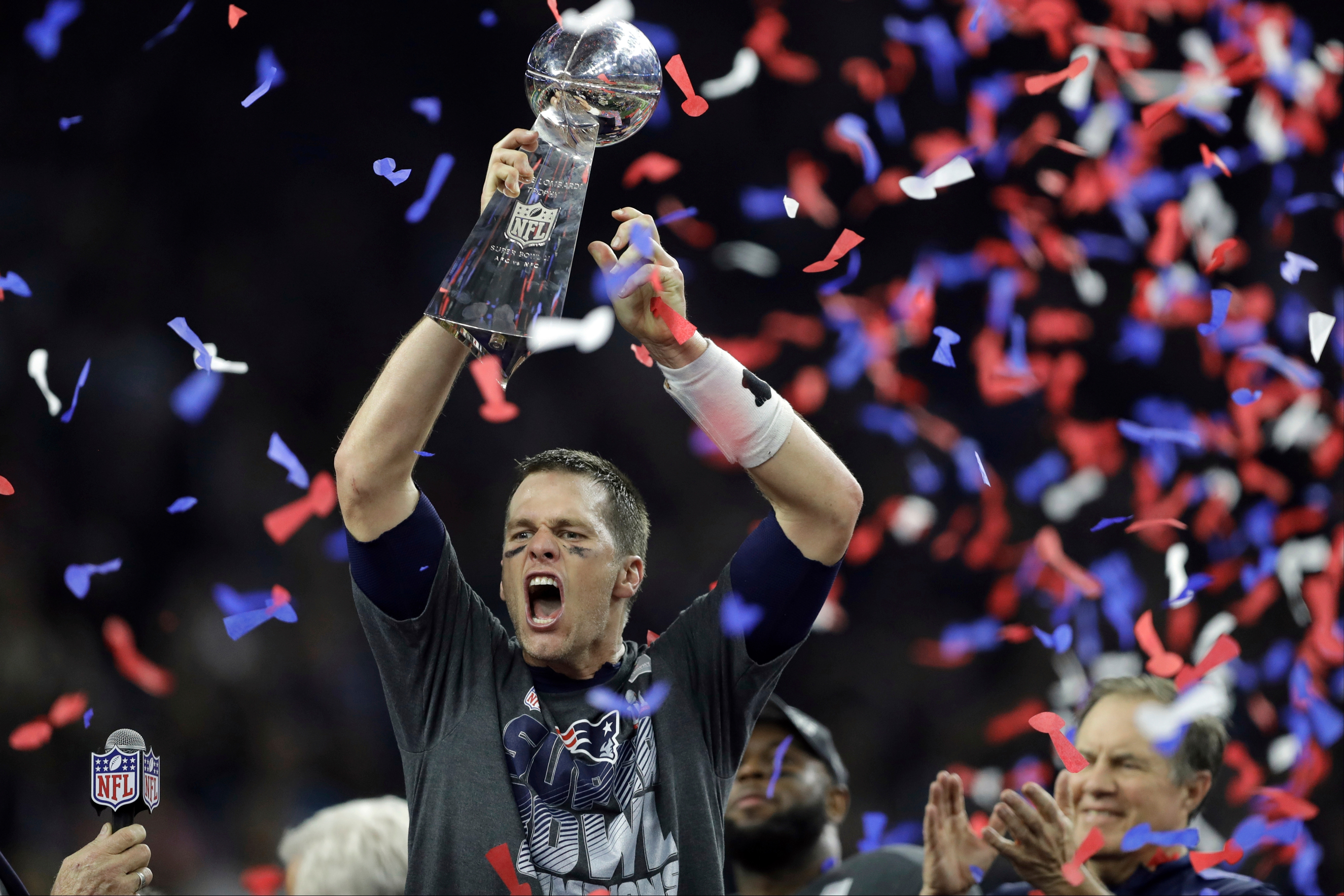 New England Patriots' Tom Brady raises the Vince Lombardi Trophy after defeating the Atlanta Falcons in overtime at the NFL Super Bowl 51 football game Sunday, Feb. 5, 2017, in Houston. The Patriots defeated the Falcons 34-28. (AP Photo/Darron Cummings)