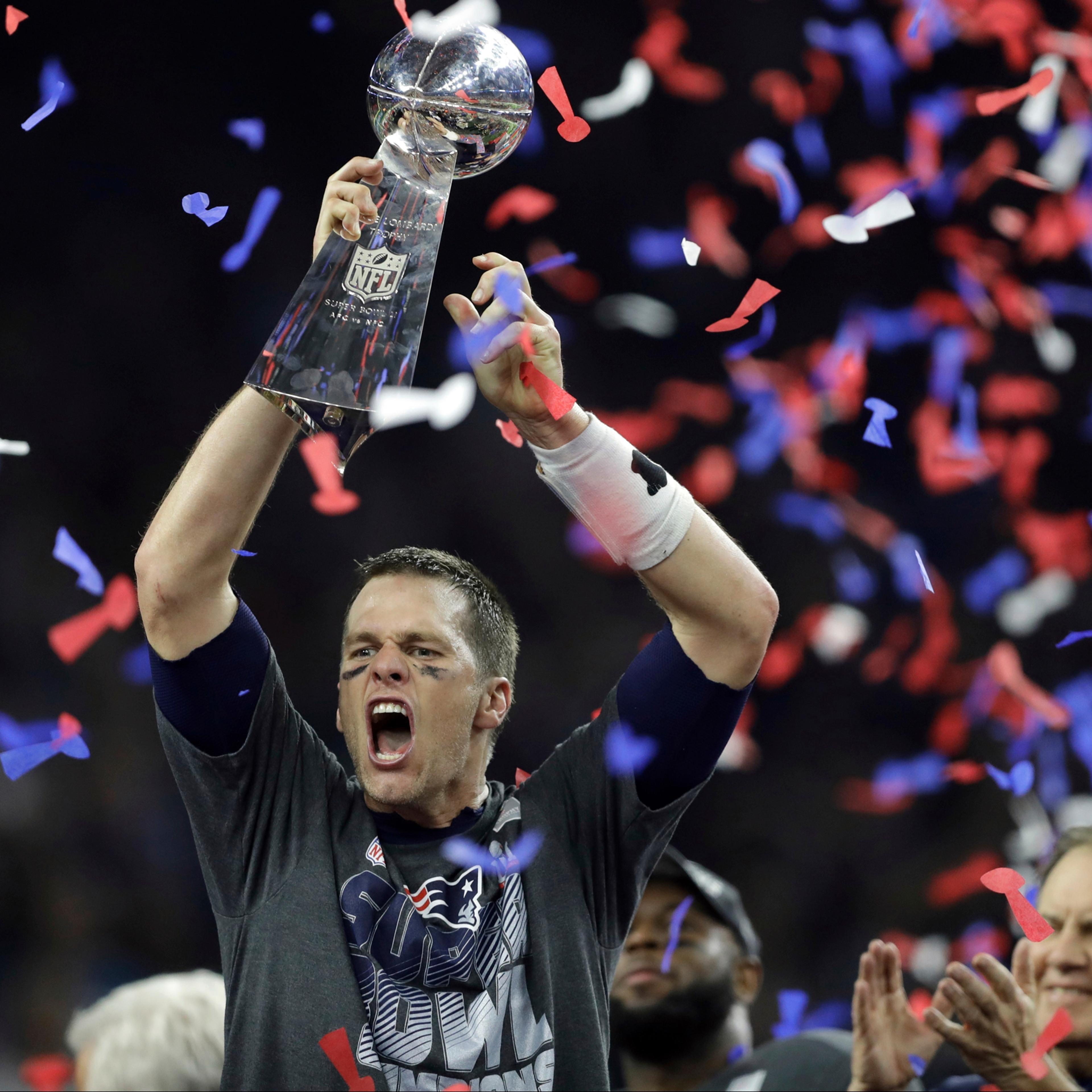 New England Patriots' Tom Brady raises the Vince Lombardi Trophy after defeating the Atlanta Falcons in overtime at the NFL Super Bowl 51 football game Sunday, Feb. 5, 2017, in Houston. The Patriots defeated the Falcons 34-28. (AP Photo/Darron Cummings)