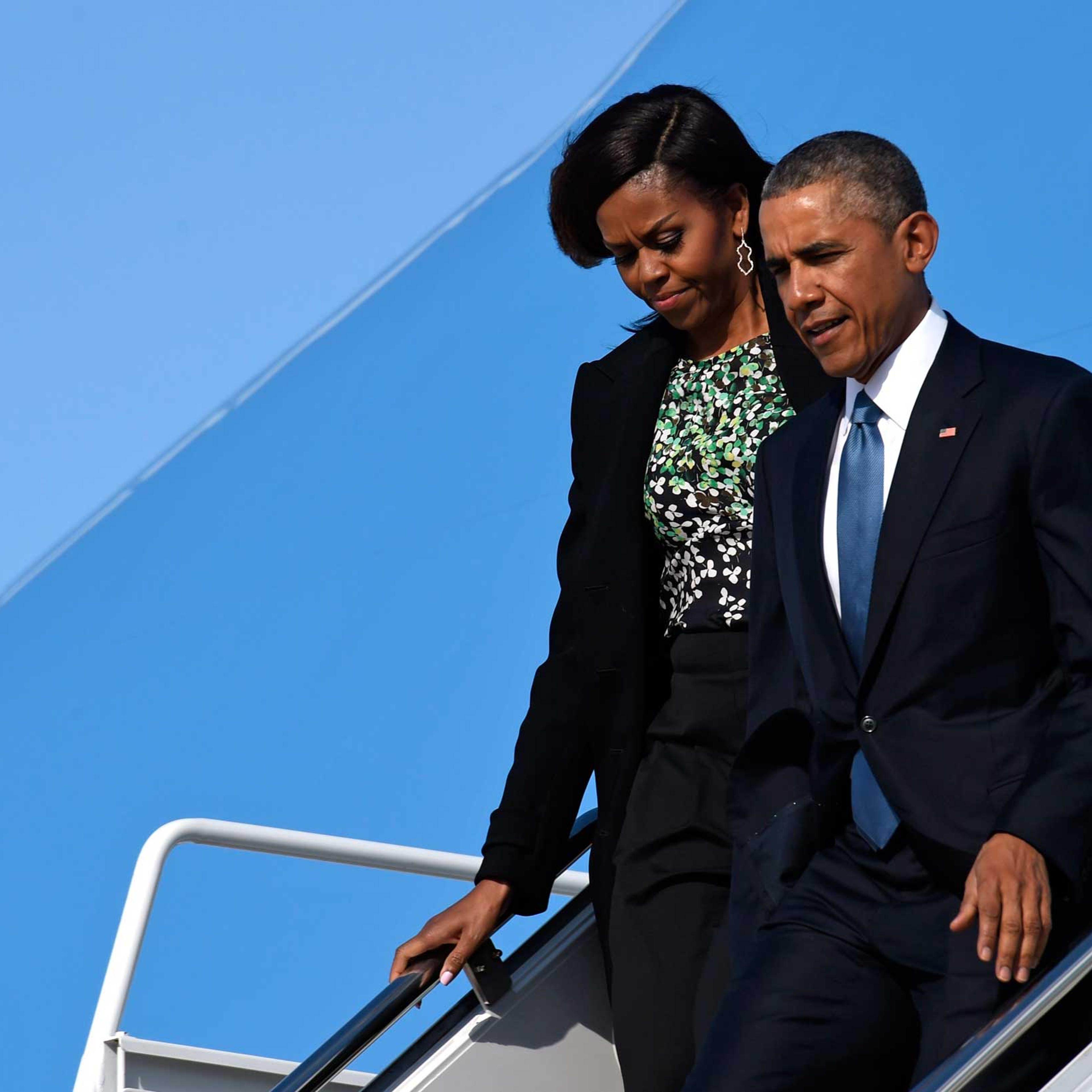 President Barack Obama and first lady Michelle Obama walk down the steps of Air Force One at Andrews Air Force Base in Md., Monday, March 30, 2015.