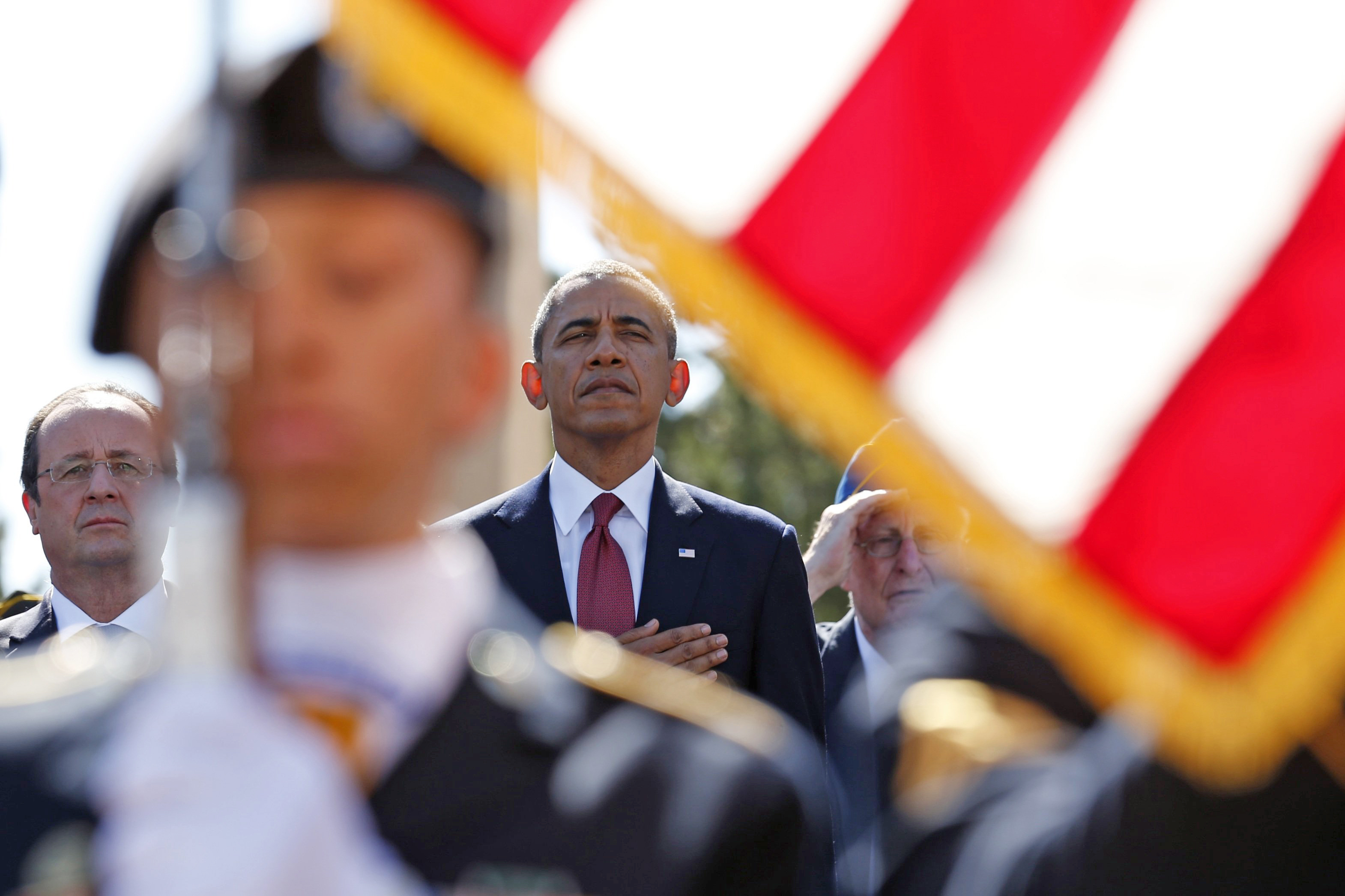 From left: French President Francois Hollande and U.S. President Barack Obama participate in the 70th French-American Commemoration D-Day Ceremony at the Normandy American Cemetery and Memorial in Colleville-sur-Mer on June 6, 2014.