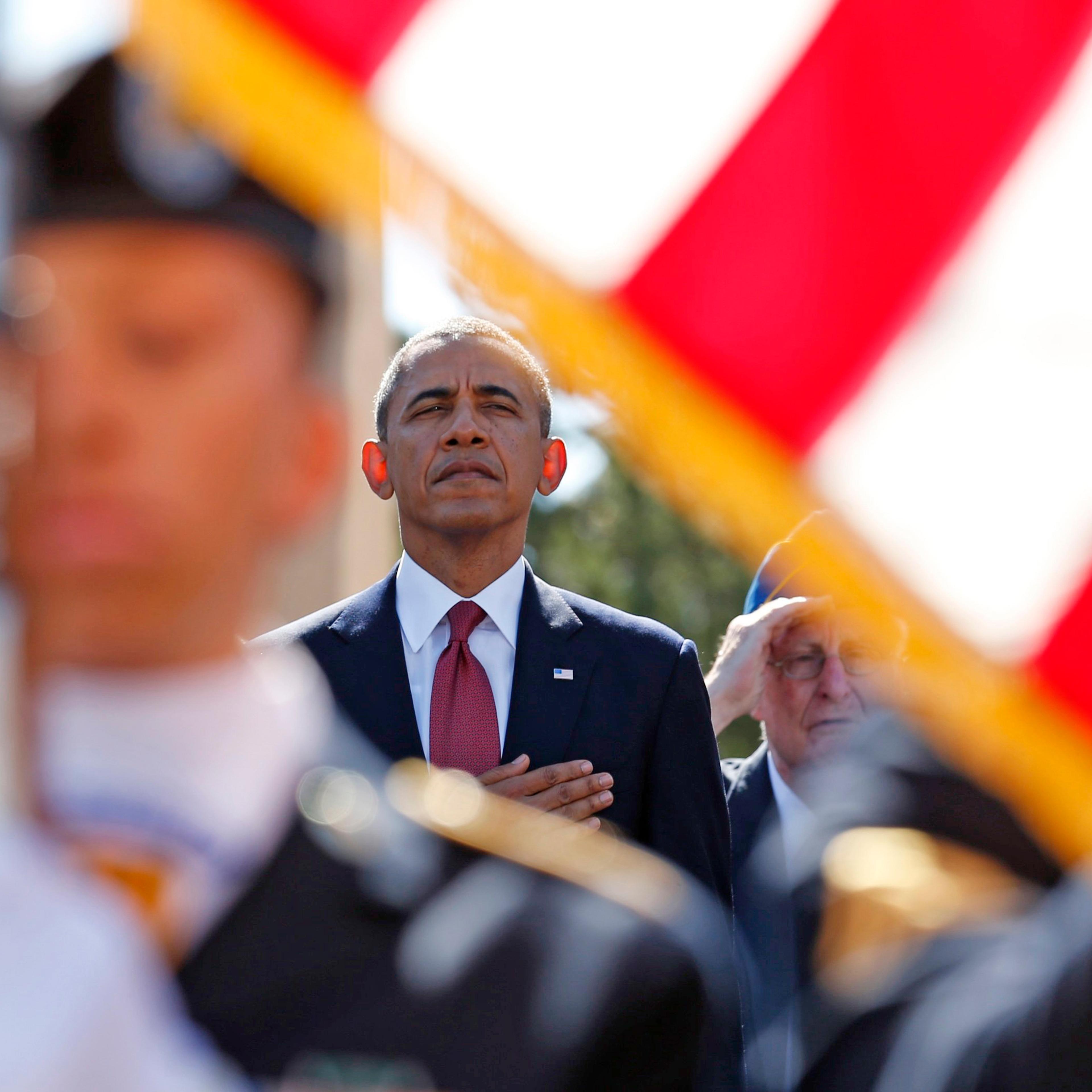 From left: French President Francois Hollande and U.S. President Barack Obama participate in the 70th French-American Commemoration D-Day Ceremony at the Normandy American Cemetery and Memorial in Colleville-sur-Mer on June 6, 2014.