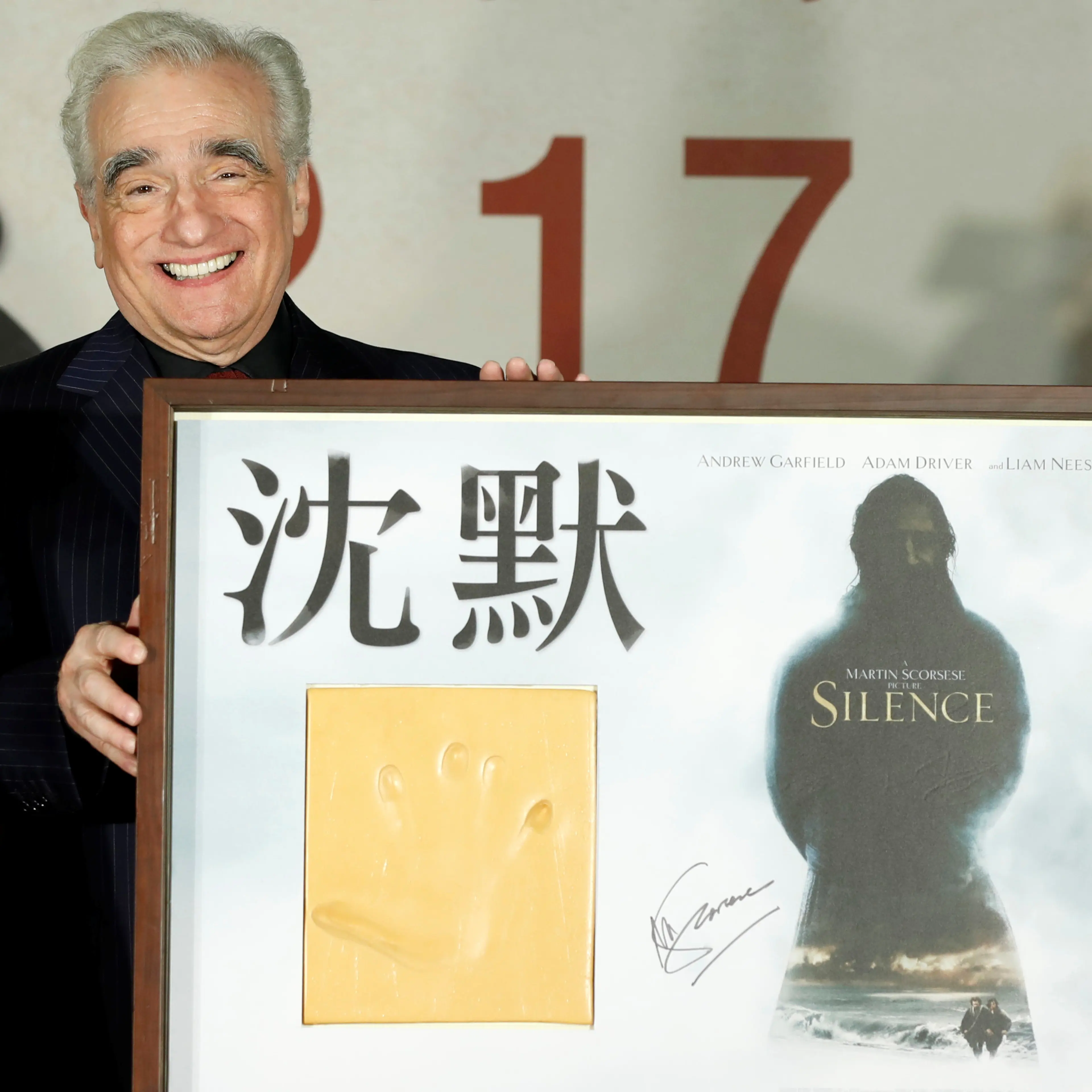 U.S. director Martin Scorsese poses with his handprint during the premiere of "Silence", in Taipei