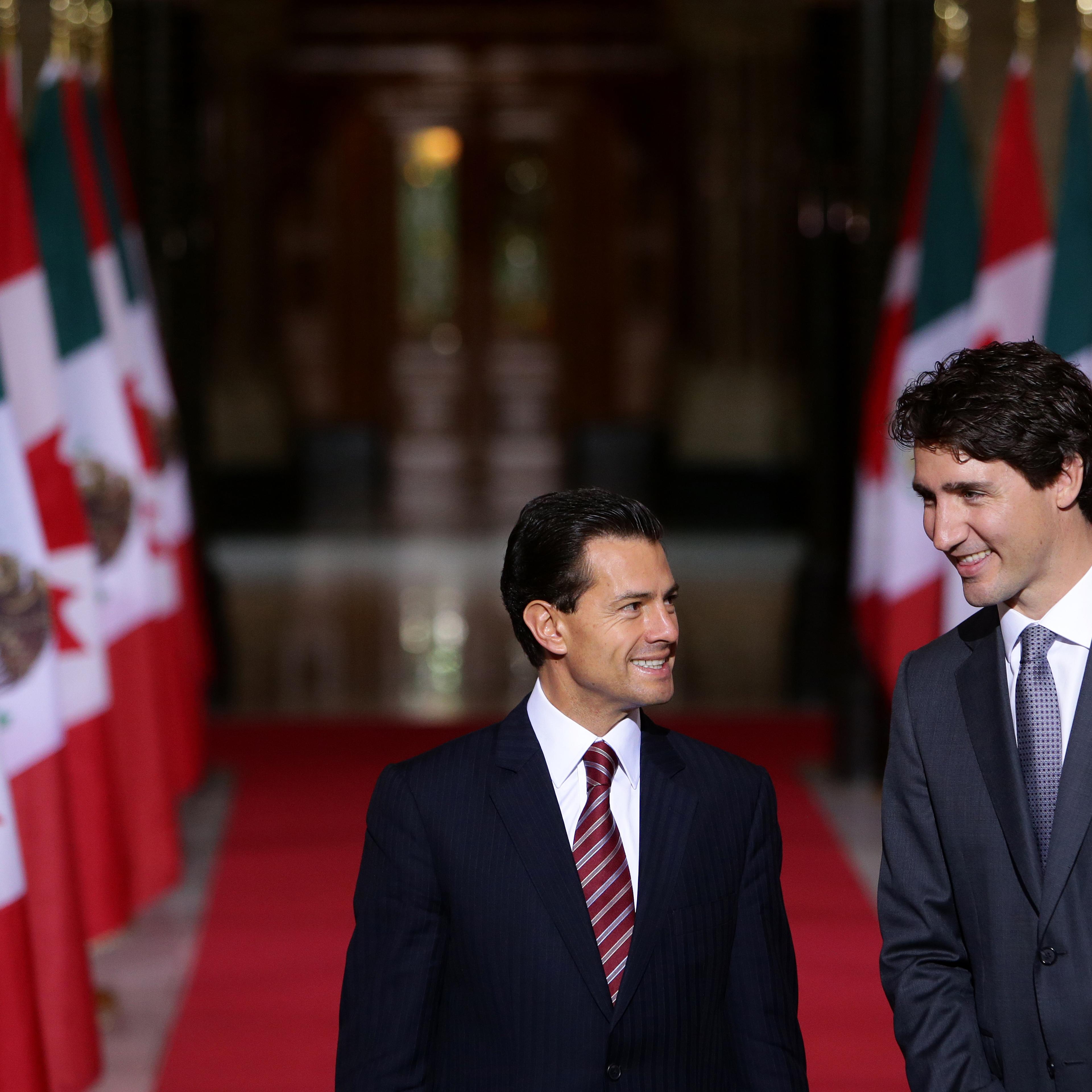 Justin Trudeau, Canada's prime minister, right, smiles with Enrique Pena Nieto, Mexico's president, in the Hall of Honour at Parliament Hill ahead of the North American Leaders Summit (NALS) in Ottawa, Ontario, Canada, on June 28, 2016.