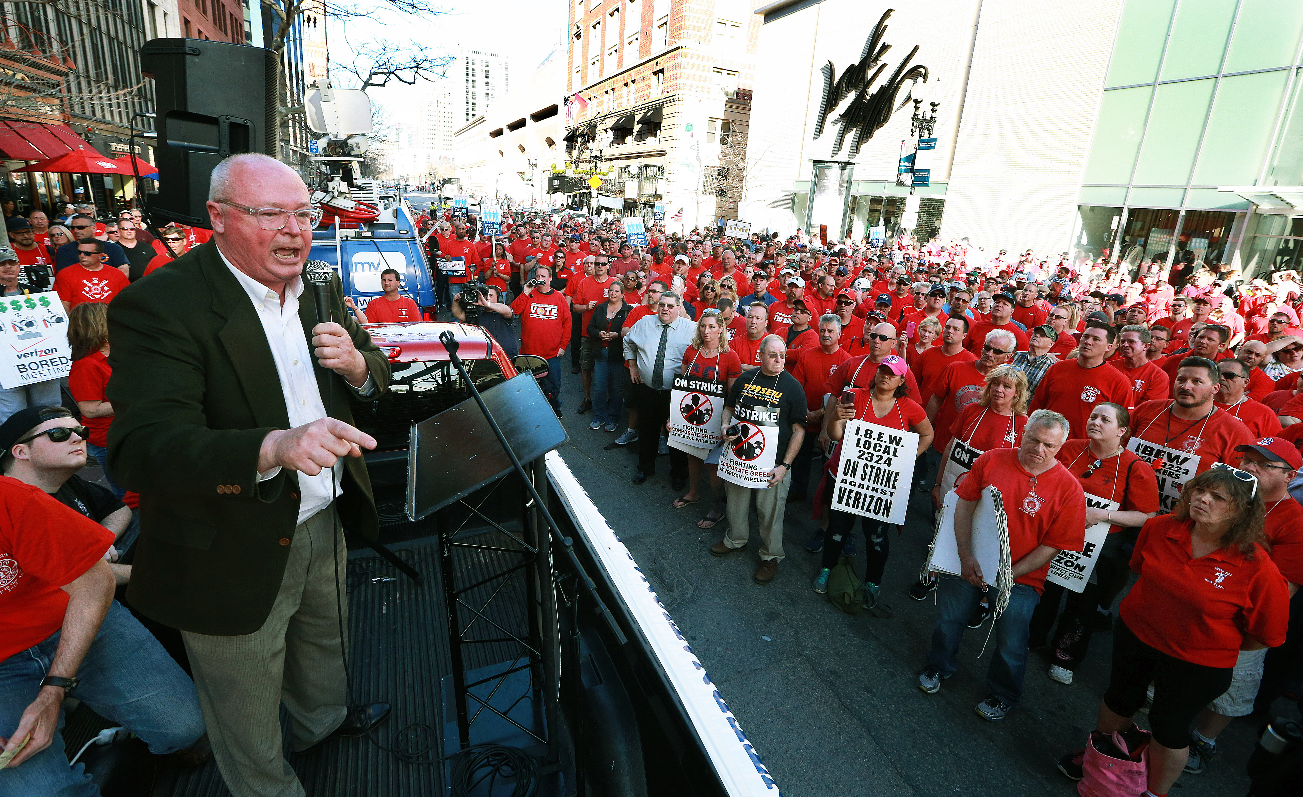 Striking Verizon employees staged a rally in Copley Square, followed by a march to a Verizon Destination Store on Boylston Street, where union officials spoke to the crowd from the back of a pickup truck.