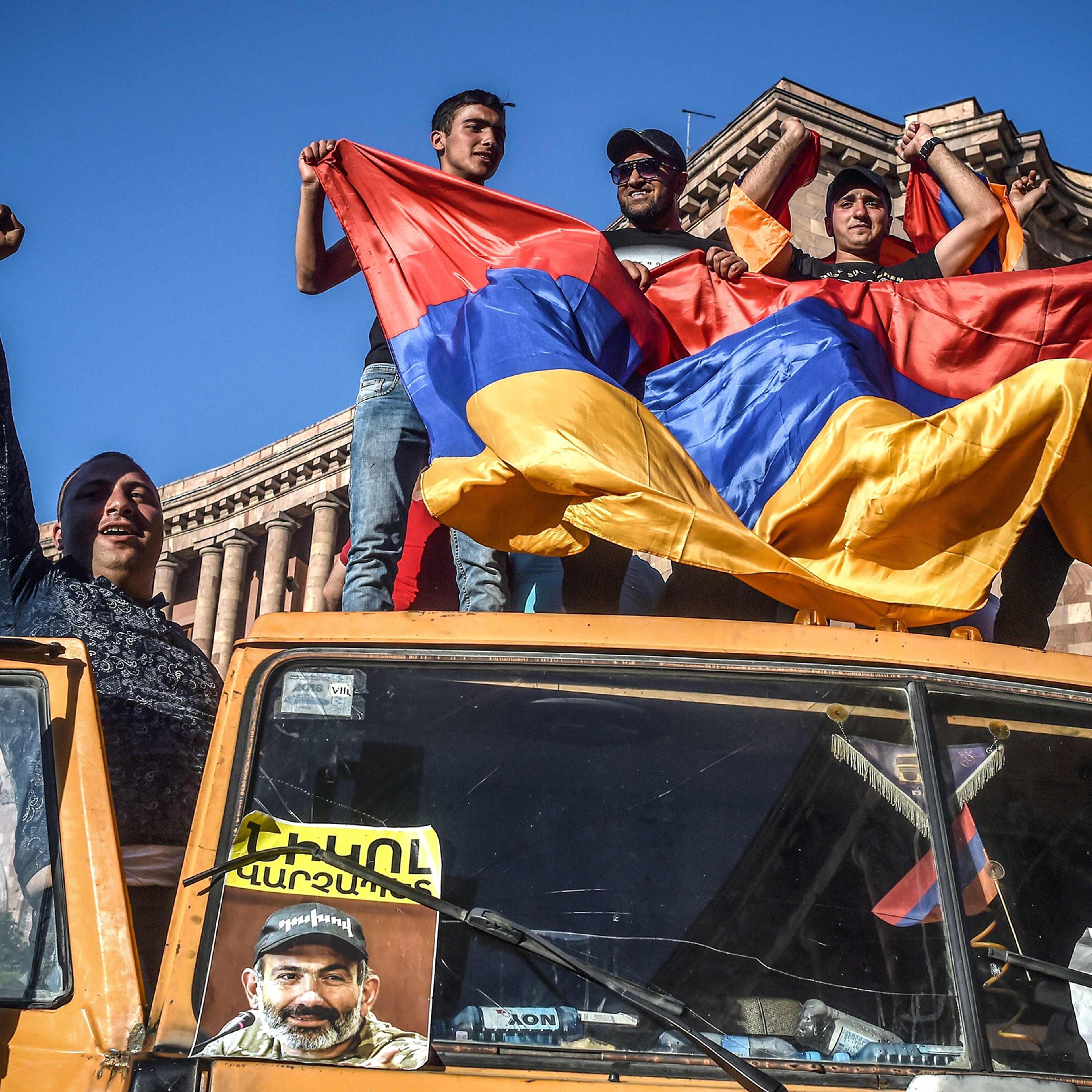 Armenian Protesters in Yerevan on truck with photo of Pashinyan