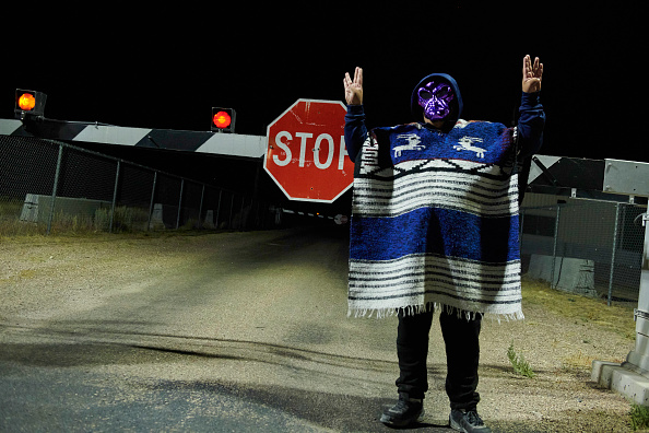 A man poses for photos as attendees gather to "storm" Area 51 at an entrance to the military facility near Rachel, Nevada on September 20, 2019.
