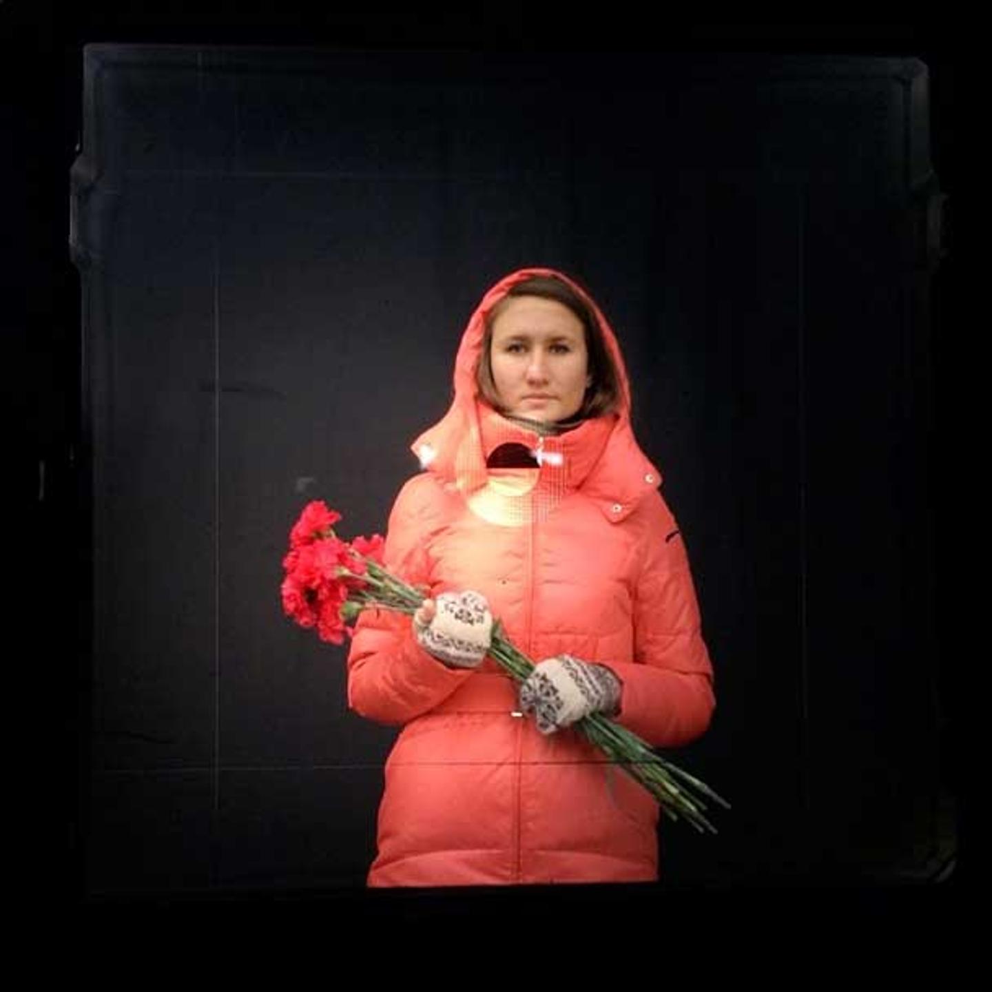 "This is the first quiet day for Kiev's residents to come here. So we came to put flowers and pay respect to the people who died." —Olga, 26 years old, from Kiev "Today there is mourning" From my dispatch with viewfinder portraits from Maidan, Kiev on Fo