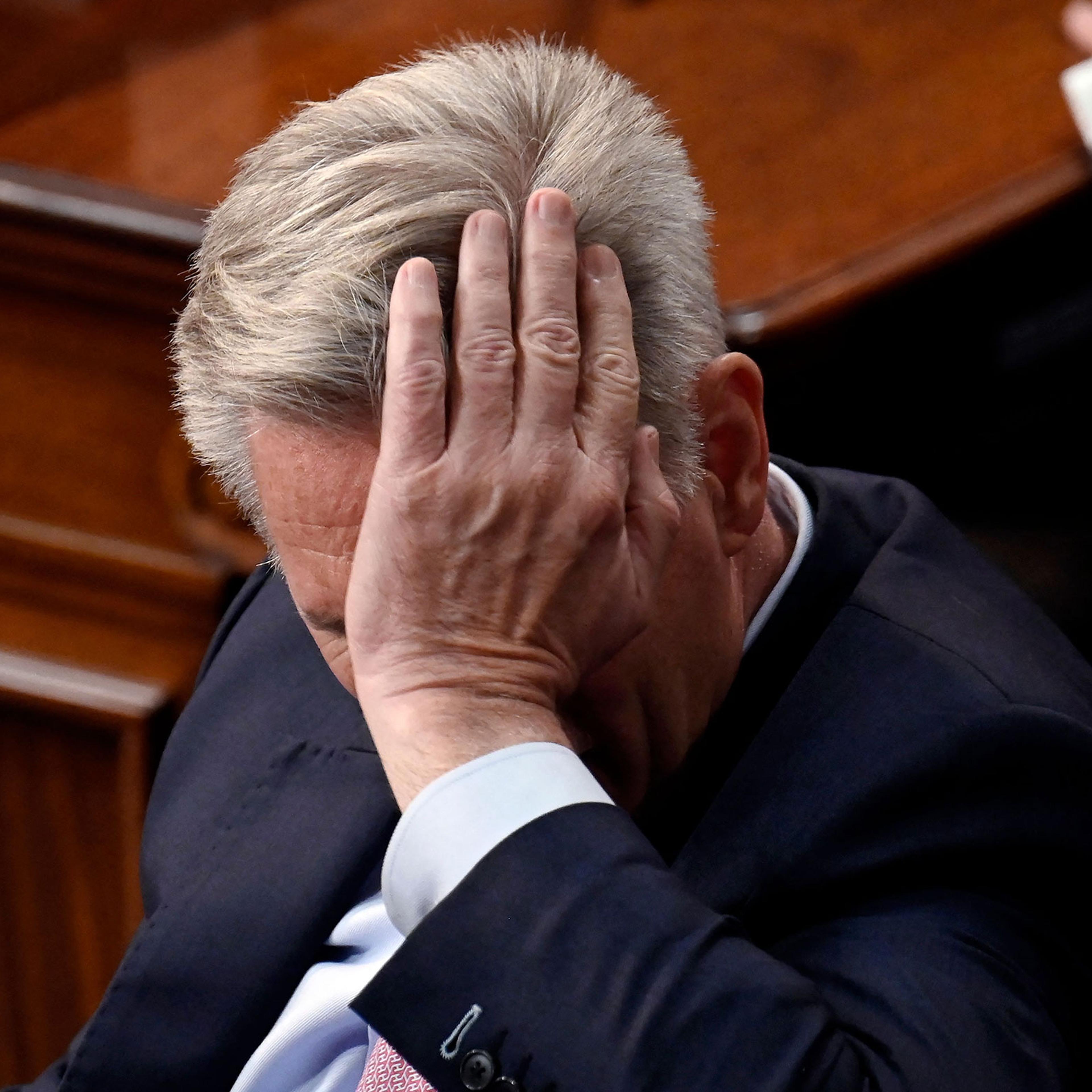 Rep. Kevin McCarthy listens as lawmakers take a 13th vote for House Speaker at the US Capitol in Washington, on Jan. 6, 2023.