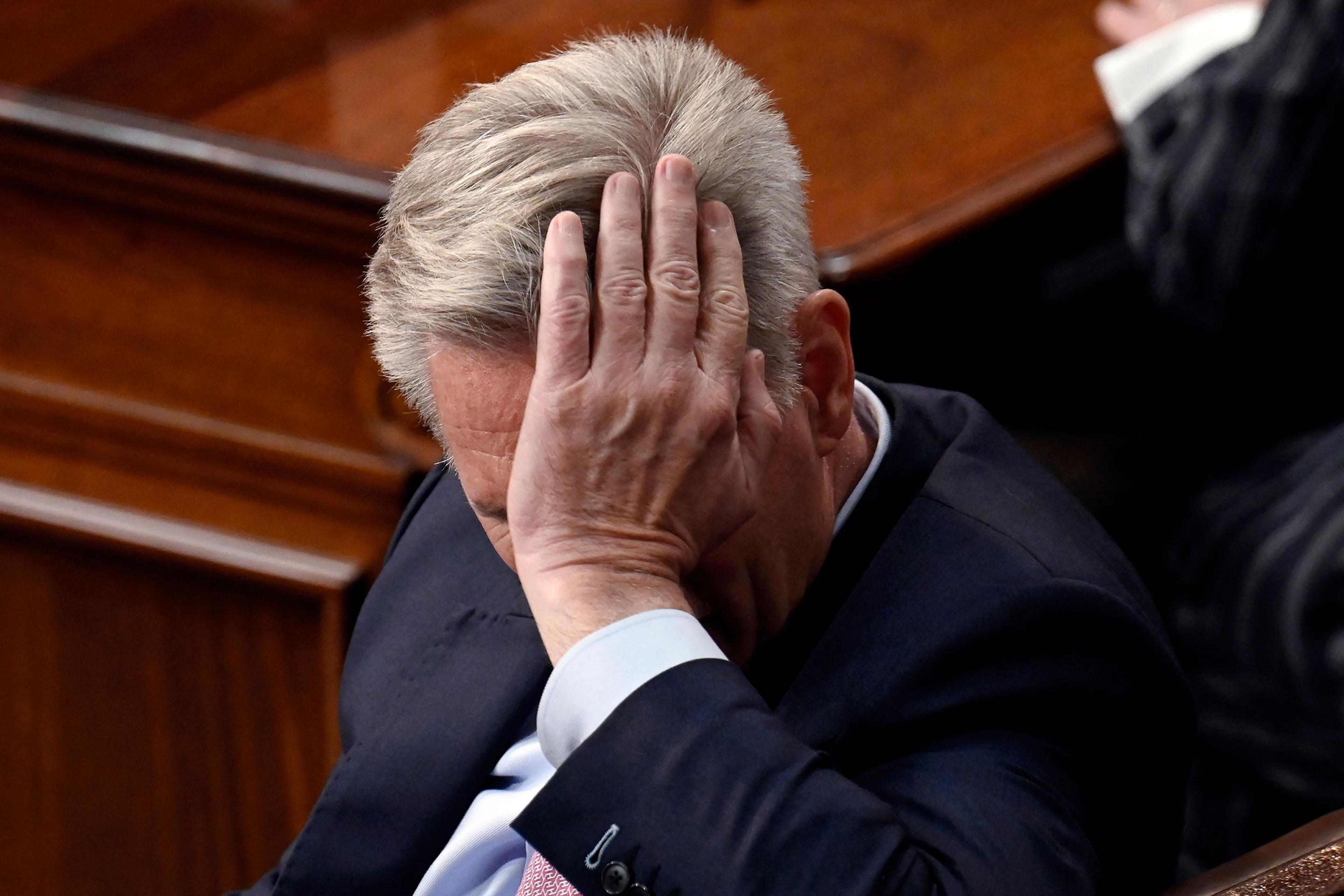 Rep. Kevin McCarthy listens as lawmakers take a 13th vote for House Speaker at the US Capitol in Washington, on Jan. 6, 2023.