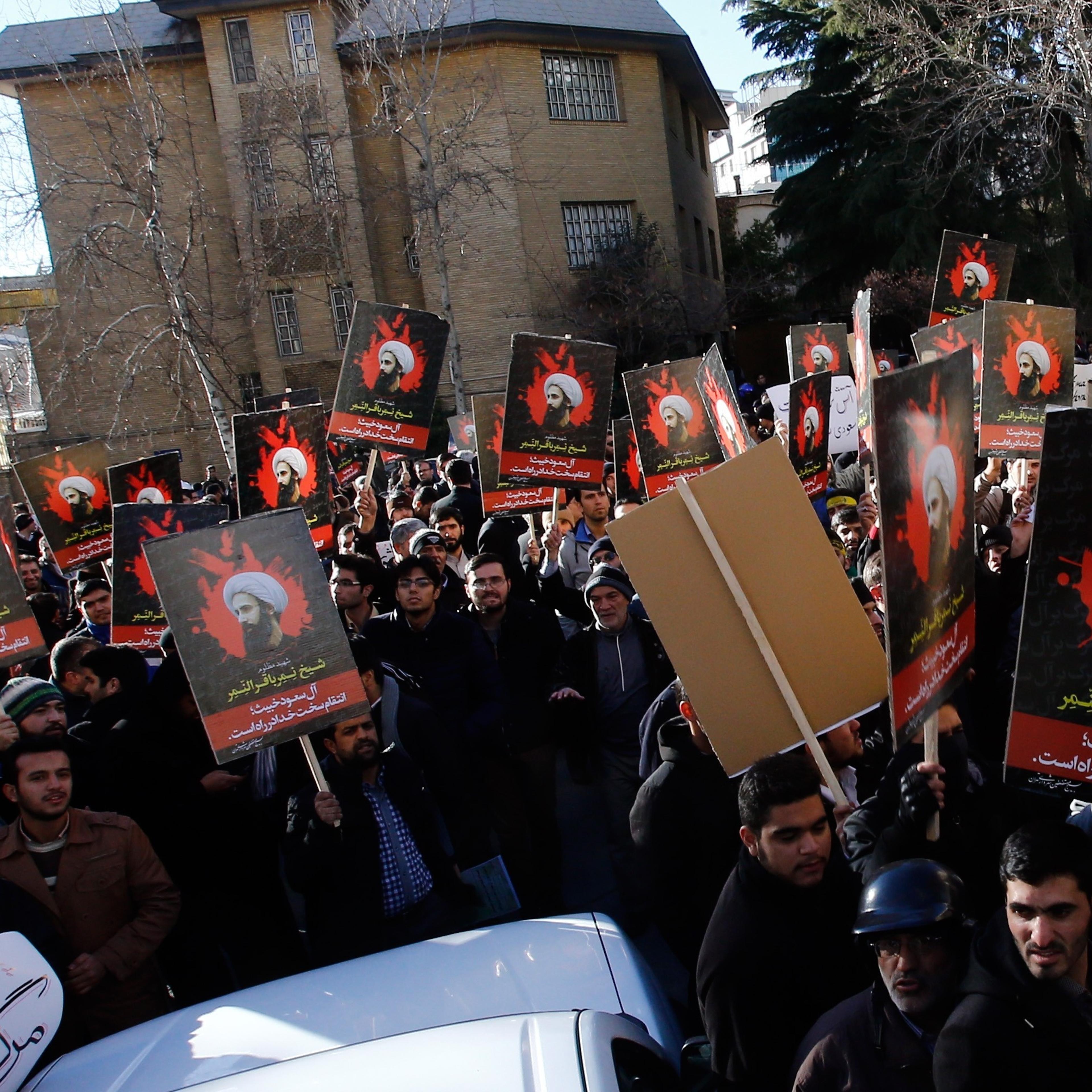 Demonstrators hold posters of Nimr Baqir al-Nimr and shout slogans during a protest rally outside the embassy of Saudi Arabia against the execution of prominent Saudi Shia cleric Nimr Baqir al-Nimr by Saudi authorities, in Tehran, Iran on Jan. 3 2016.