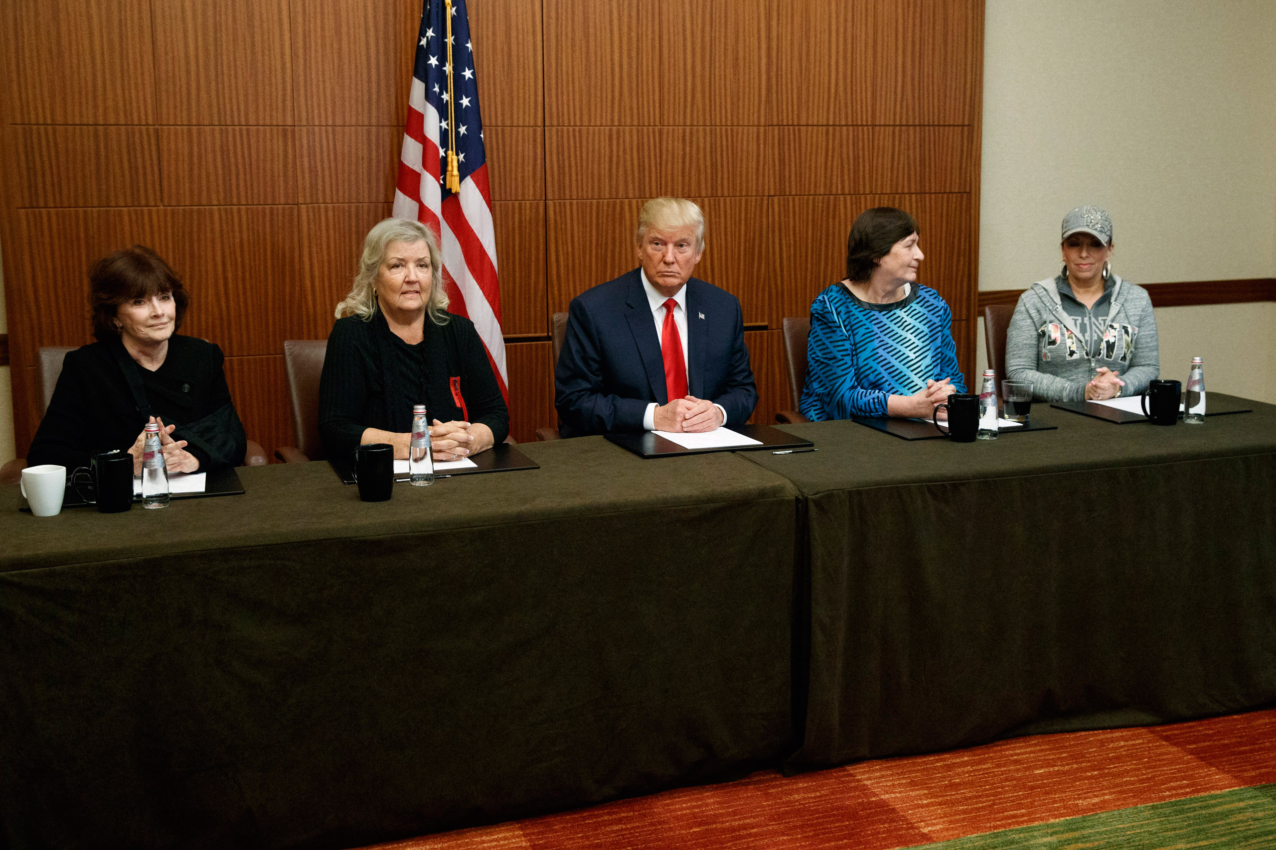 Republican presidential candidate Donald Trump, center, sits with, from right, Paula Jones, Kathy Shelton, Juanita Broaddrick, and Kathleen Willey, before the second presidential debate with Democratic presidential candidate Hillary Clinton at Washington