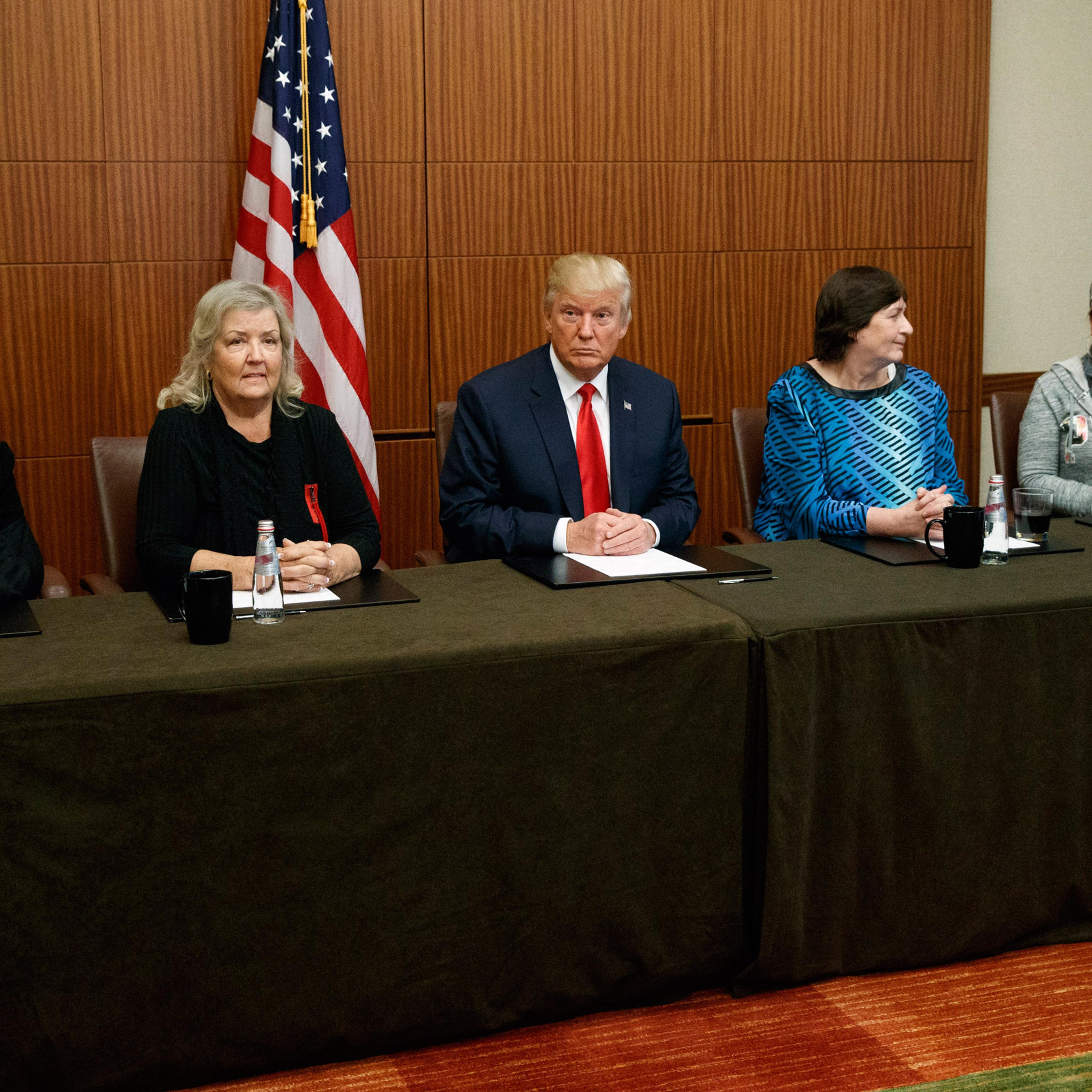 Republican presidential candidate Donald Trump, center, sits with, from right, Paula Jones, Kathy Shelton, Juanita Broaddrick, and Kathleen Willey, before the second presidential debate with Democratic presidential candidate Hillary Clinton at Washington
