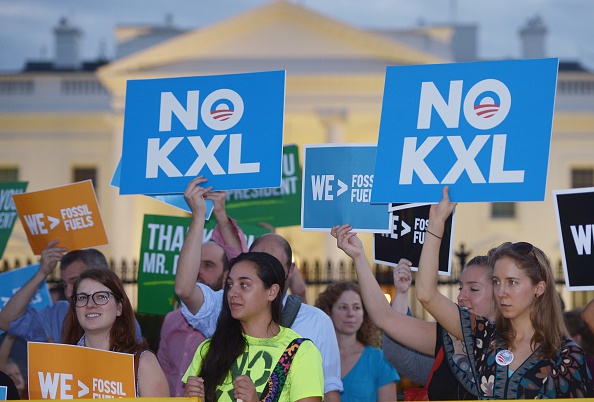 Activists, celebrating US President Barack Obama's blocking of the Keystone XL oil pipeline, rally in front of the White House in Washington, DC on November 6, 2015.
