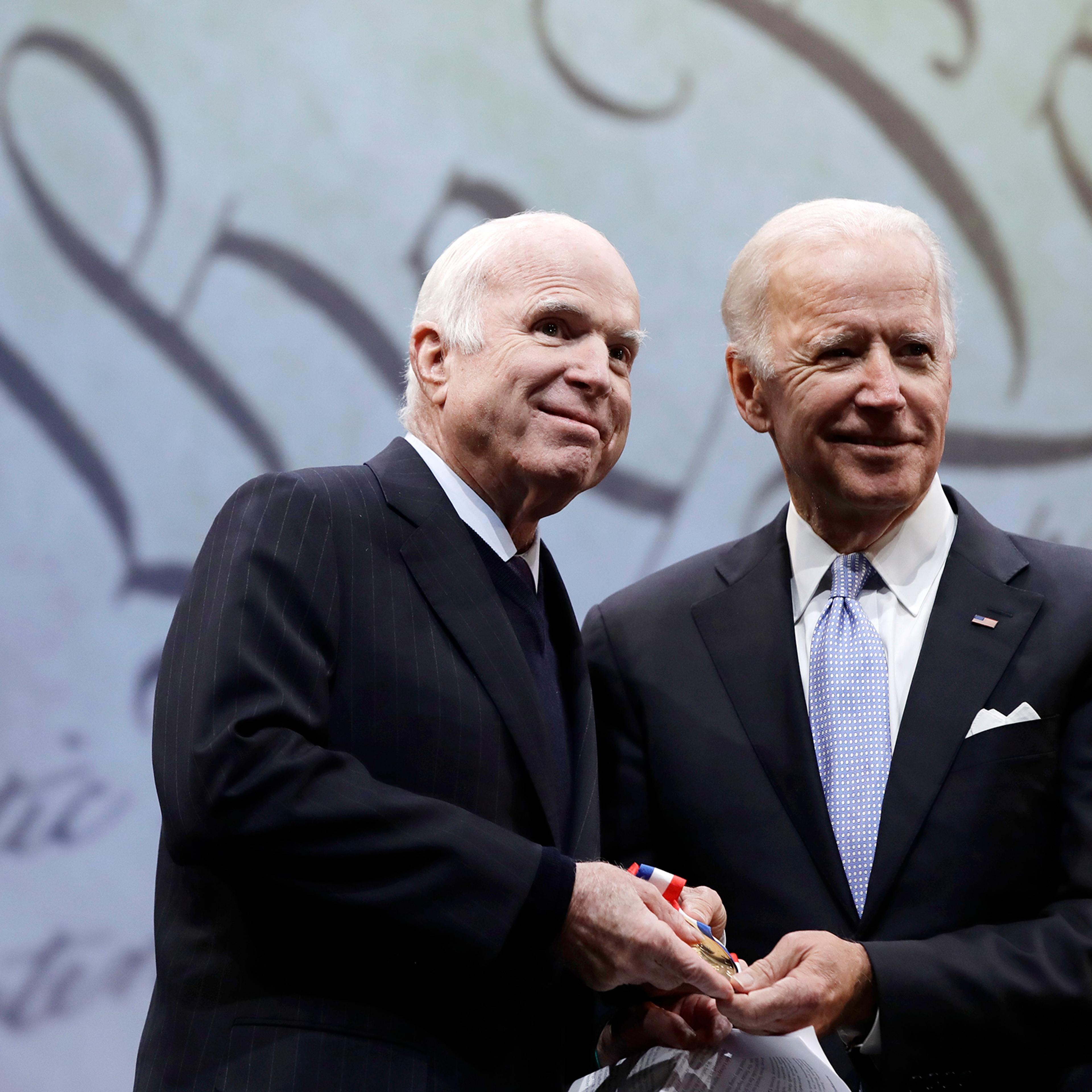 Sen. John McCain receives the Liberty Medal from former Vice President Joe Biden in Philadelphia, Oct. 16, 2017