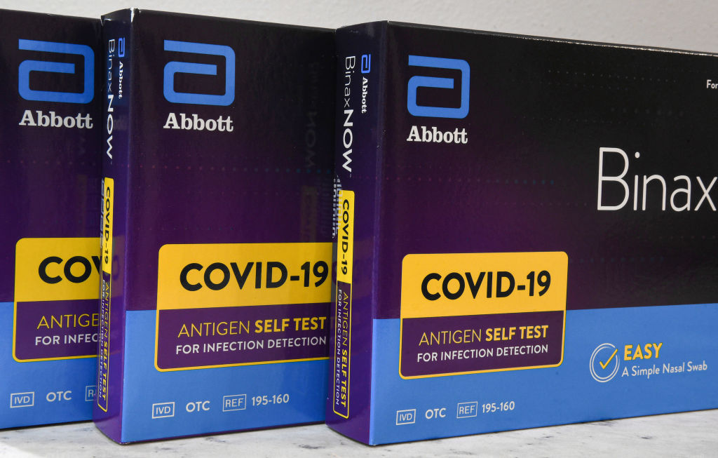 In this photo illustration, the Abbott's at-home covid-19
