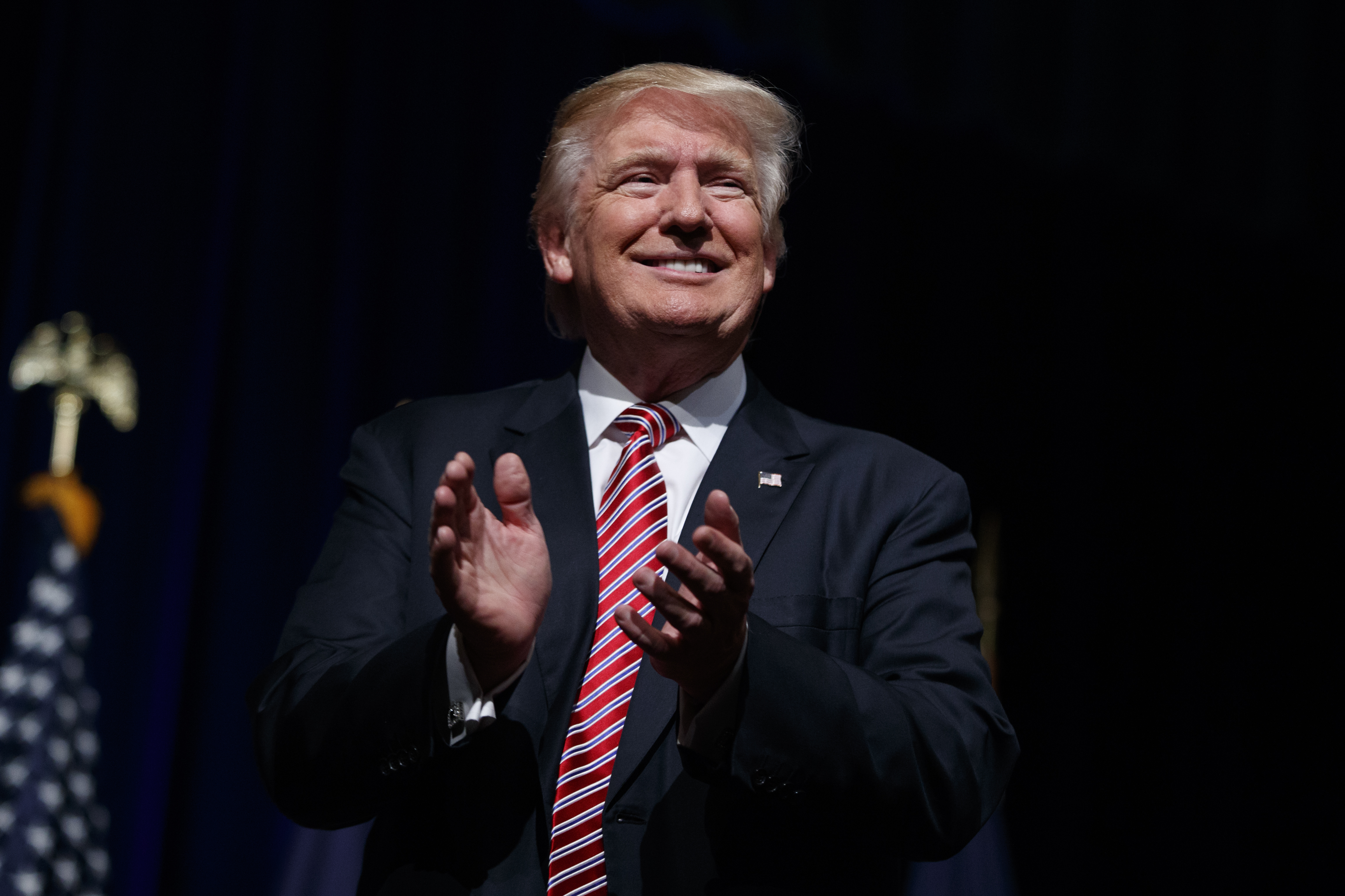 Donald Trump applauds during a campaign rally at Briar Woods High School, on Aug. 2, 2016 in Ashburn, Va.