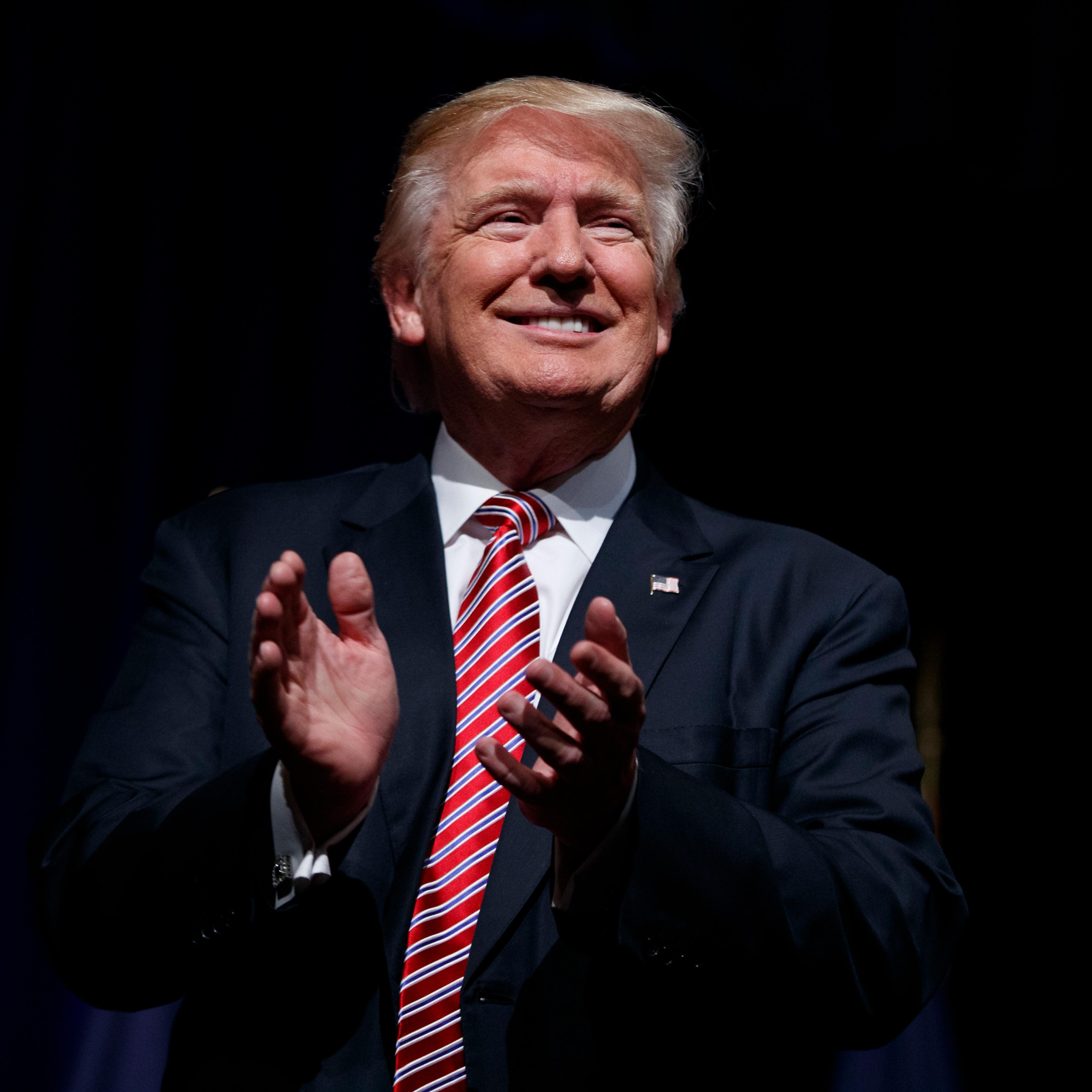 Donald Trump applauds during a campaign rally at Briar Woods High School, on Aug. 2, 2016 in Ashburn, Va.