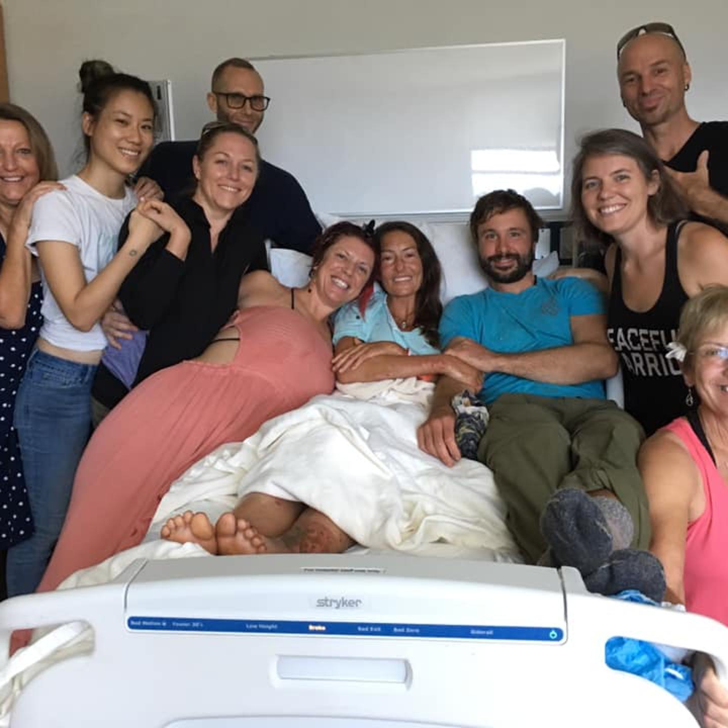 Amanda Eller (center) recovers following more than two weeks lost in the Maui wilderness