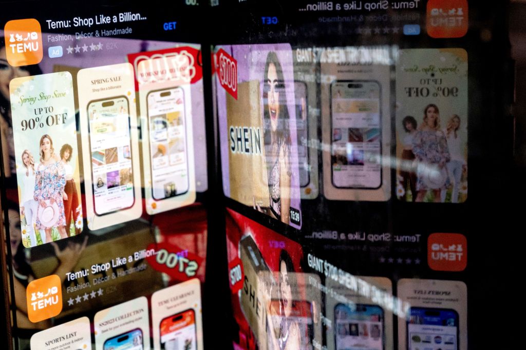 The Temu app in the App Store is reflected in videos of Shein consumers, in Washington, DC, on Feb. 23, 2023.