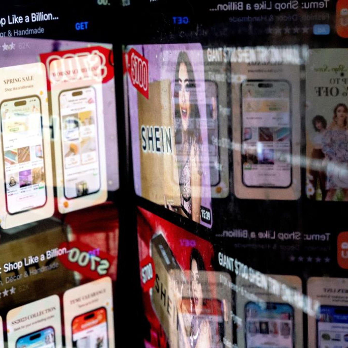 The Temu app in the App Store is reflected in videos of Shein consumers, in Washington, DC, on Feb. 23, 2023.