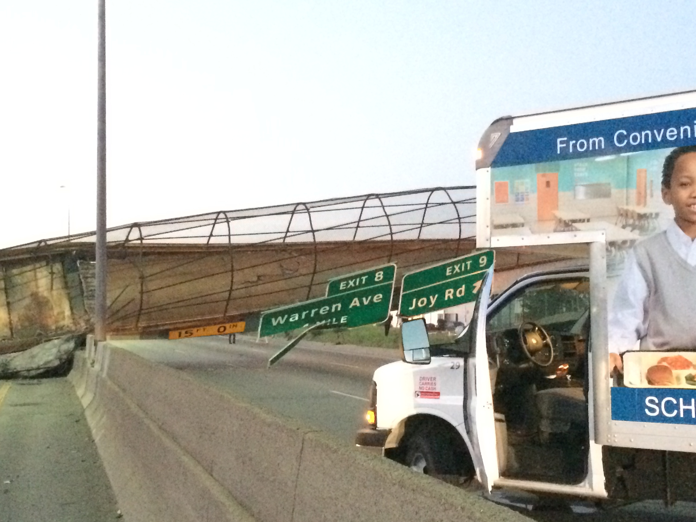 The Cathedral Road pedestrian bridge lies collapsed on the south M-39 highway after a truck hit it on Sept. 26, 2014, in Detroit.
