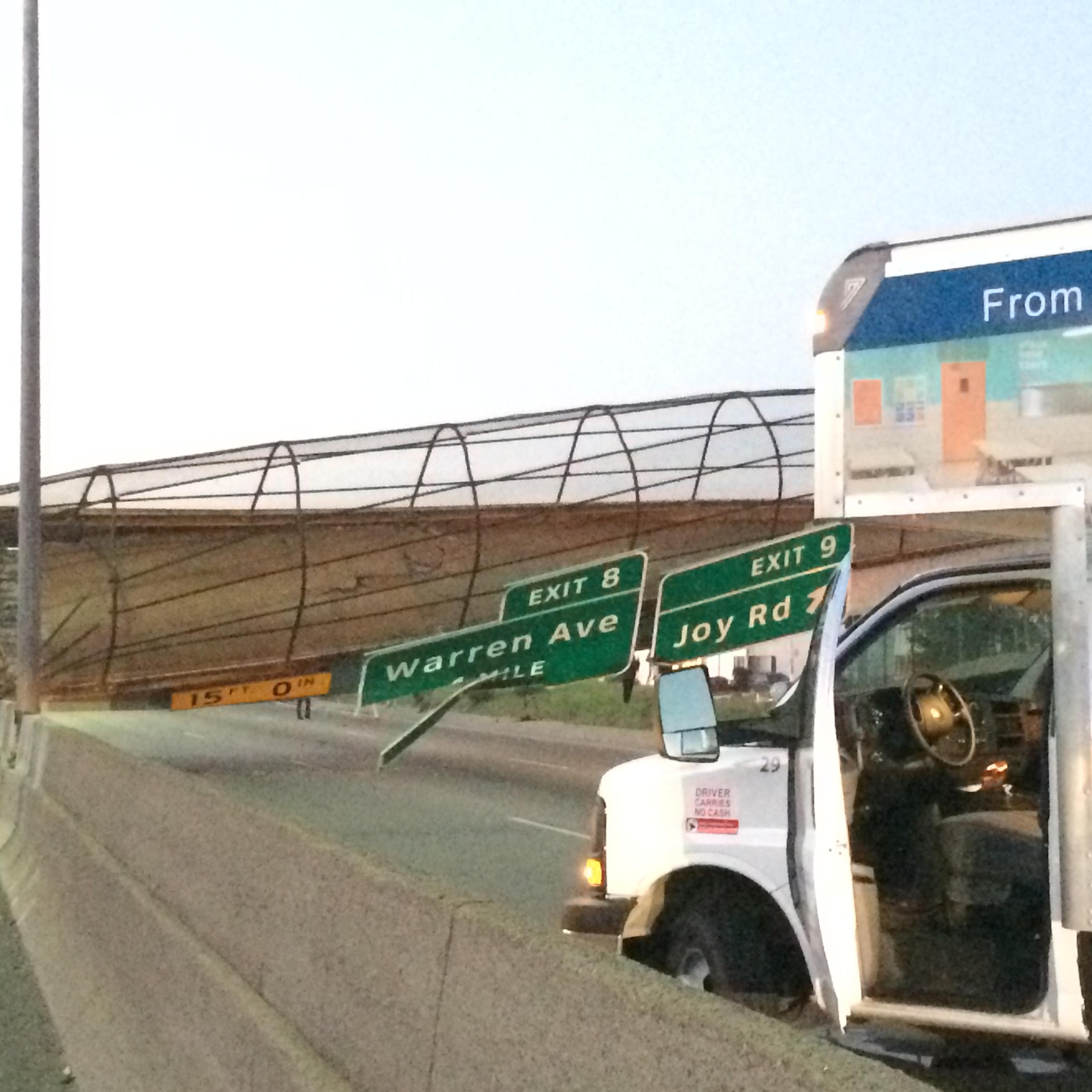 The Cathedral Road pedestrian bridge lies collapsed on the south M-39 highway after a truck hit it on Sept. 26, 2014, in Detroit.