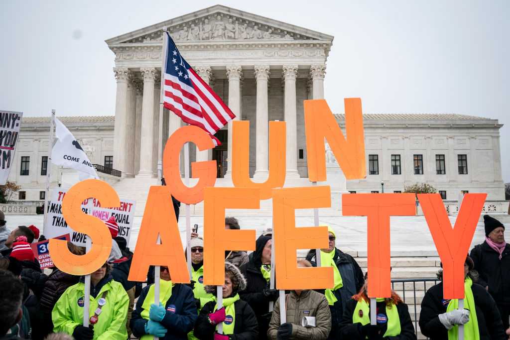 Gun safety advocates rally in front of the U.S. Supreme Court