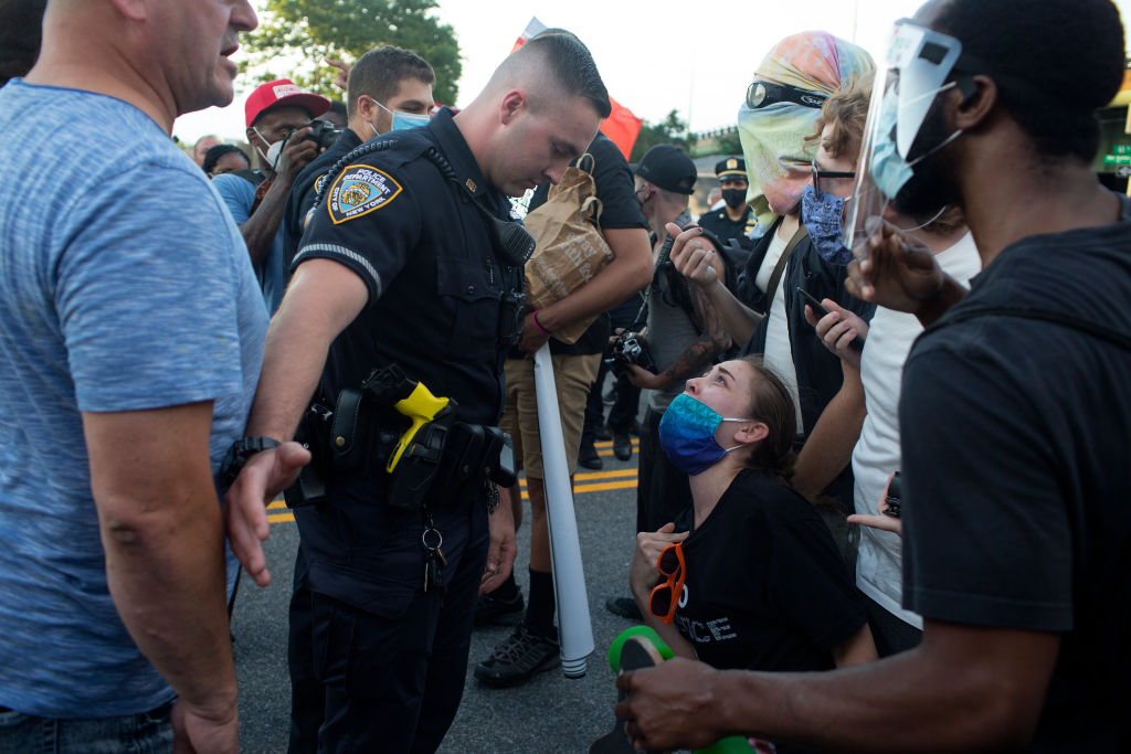 Blue Lives Matter and Black Lives Matters marchers confront each other in Brooklyn